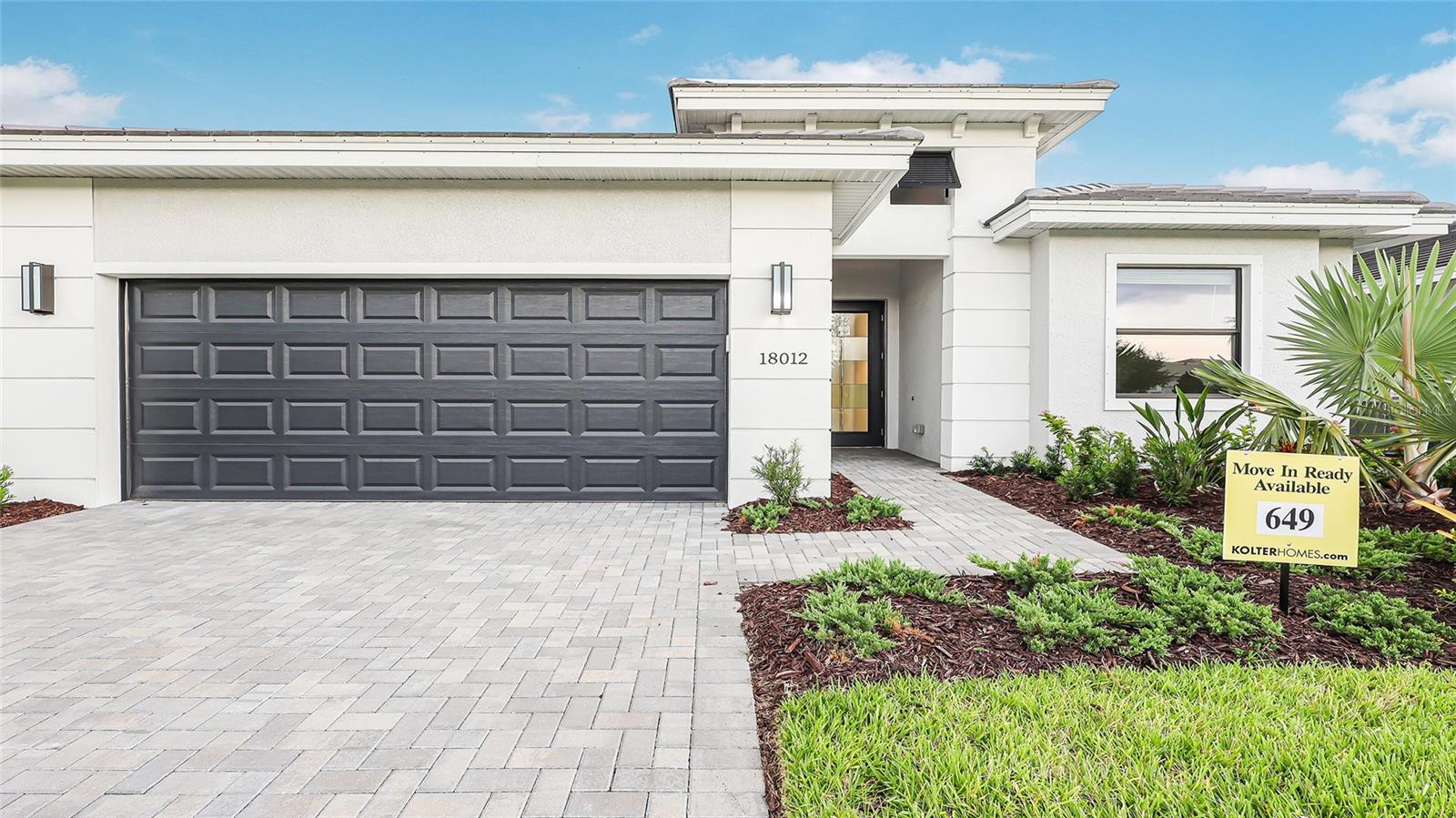 **New Construction** Welcome to the Dania, a single-story residence, thoughtfully designed for both comfort and elegance. The home features 3 Bedrooms, 3 Bathrooms, and a flexible Den, ideal for an office, hobby space, or guest room. The expansive great room serves as the central gathering space, blending seamlessly with the gourmet kitchen and a casual dining area. Luxury laminate flooring adds warmth and durability throughout the interior, while stainless steel GE appliances elevate the kitchen's functionality and style.
Outdoors, the covered lanai is already prepped with plumbing, gas, and electricity, perfect for a custom summer kitchen or future pool. Thanks to the southern exposure, natural light fills the home throughout the day, creating a bright and inviting atmosphere. Situated on a private berm homesite with no neighboring homes behind, the spacious backyard offers quiet seclusion and plenty of room to personalize. Located in a gated community and equipped with Taexx built-in pest control and tray ceilings that add architectural interest, this home combines thoughtful features with timeless appeal.