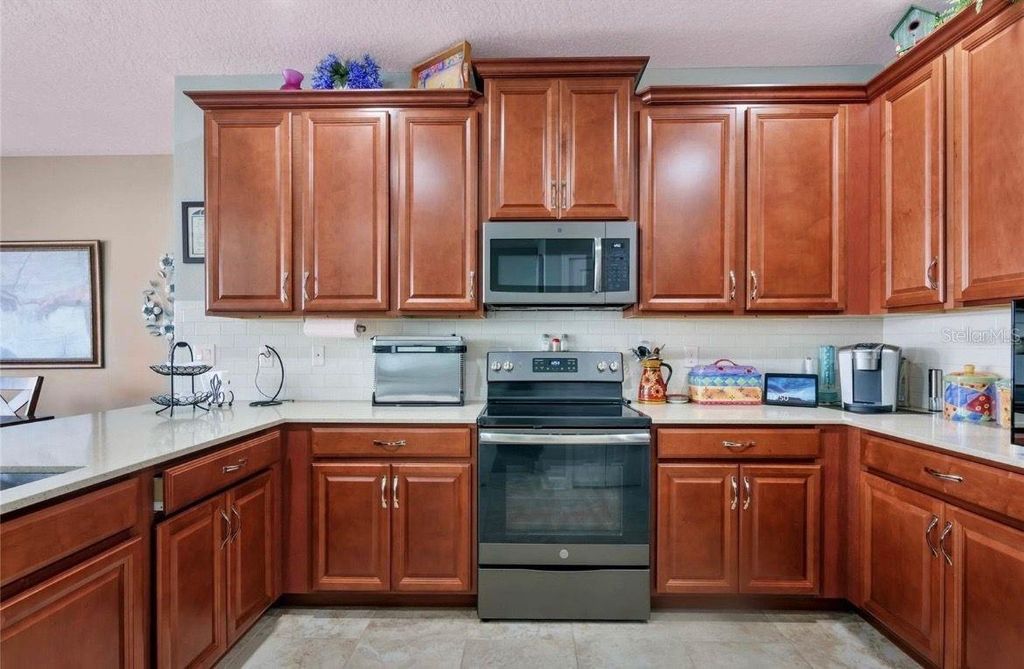 Photo of 12426 Turtle Grass Drive, Orlando, FL 32824 (MLS # S5141024)