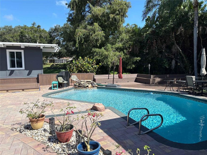 Welcome to our peaceful Tropical Lagoon with private pool and game room! Step into relaxation as soon as you arrive. Nestled in a quiet neighborhood, this home is perfect for enjoying with friends or family. Located only a short driving distance to Safety Harbor, Dunedin, and Clearwater Beach…you’re sure to find several local restaurants, shopping, and world-renowned beaches.

**IMPORTANT, PLEASE READ** Please be aware that this home has a lot of steps inside the house. There are 3 steps up to the front door and one additional step to get inside the house. Once you are inside, there is one step down into the dining room, an additional two steps down into the master bedroom. One more step down into the twin bed and closet area of the Master bedroom. The Main Kitchen, Living Room, Two Bedrooms, and Two bathrooms are all on one level and do not require Steps. Please let us know if you have any questions or concerns about the flooring before booking. Thank you!

Our Tropical Lagoon features include: 
* LIVING AREA: Comfy Sectional Sofa with plenty of seating and a Flat Screen Smart TV 
*GAME ROOM: Equipped with Arcade Games such as Pac-Man and NFL Blitz, Foosball Table, Couch, and French Doors that open to back deck.
* DINING AREA: Seating with room for 6 at table. Additional seating for 2 in the kitchen. Dining room has double french doors that open to pool area.
* KITCHEN: Completely stocked with everything you'll need...All kitchen items are new, not a mishmash of vacation rental leftovers. 
* BEDROOM 1/MASTER: Has King size bed with brand new pillows & mattress and mattress protector. Additional daybed and Small Desk/Workspace is also available in this area 
* BATHROOM 1/MASTER: Stand Up Shower
* BEDROOM 2: Has Queen size bed with new pillows & mattress and mattress protector with french doors that lead out to the back deck overlooking the lake.
*BATHROOM 2/GUEST BATH: Half Bath off the Living Room and Kitchen
*BATHROOM 3/HALLWAY: Stand up shower and Tub
* LAUNDRY ROOM: Washer/Dryer located next to master bedroom, Pack and Play is stored here along with iron and ironing board for guest use.
*BACK DECK: Fishing is allowed off the back deck. We provide Fishing rods and fishing lures. The folowing rooms has french doors that open to back deck: Living Room, Game Room, and Queen Bedroom.
*Screened in Patio (located off the pool Area): Smart tv, complimented with a sectional couch and an outdoor table with seating for 8 guests.

EXTRAS INCLUDED WITH OUR TROPICAL OASIS: 
* Beach Towels 
*Beach Chairs
*Game Room & Board Games inside
*Cornhole, Pool Toys, Baby Swim Vest, and Beach umbrella located in outside Screened Patio Area
*Fishing rods and fishing lures provided if you'd like to fish off the back deck.  There is also seating out there and solar lights.
*Complimentary Washer & Dryer 
*Portable crib & High Chair
*All Towels & Linens provided as well as a starter set of Paper towels, Trash bags, Toilet Tissue, Shampoo/Conditioner, Body Soap, Hand Soap, Dish Soap & Sponge, Laundry Detergent, Kleenex, Coffee & Creamer. Provided supplies is meant to get you started, and guests who are occupying the unit for longer periods of time may need to replenish at their own expense. 
*Use of Private Pool

 $5, 000 Off Season (May - October) / $8, 000 In Season (November-April) Fees & Taxes Addl.