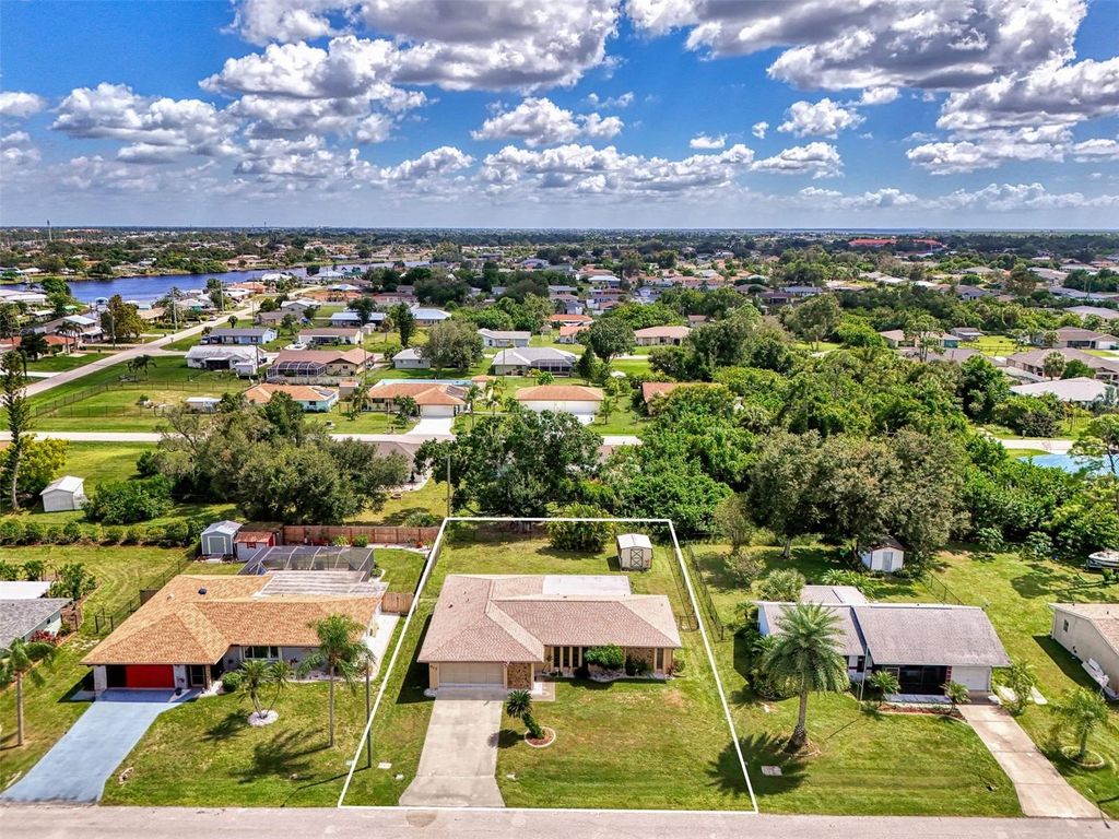 Photo of 917 Tropical Avenue NW, Port Charlotte, FL 33948 (MLS # C7515650)