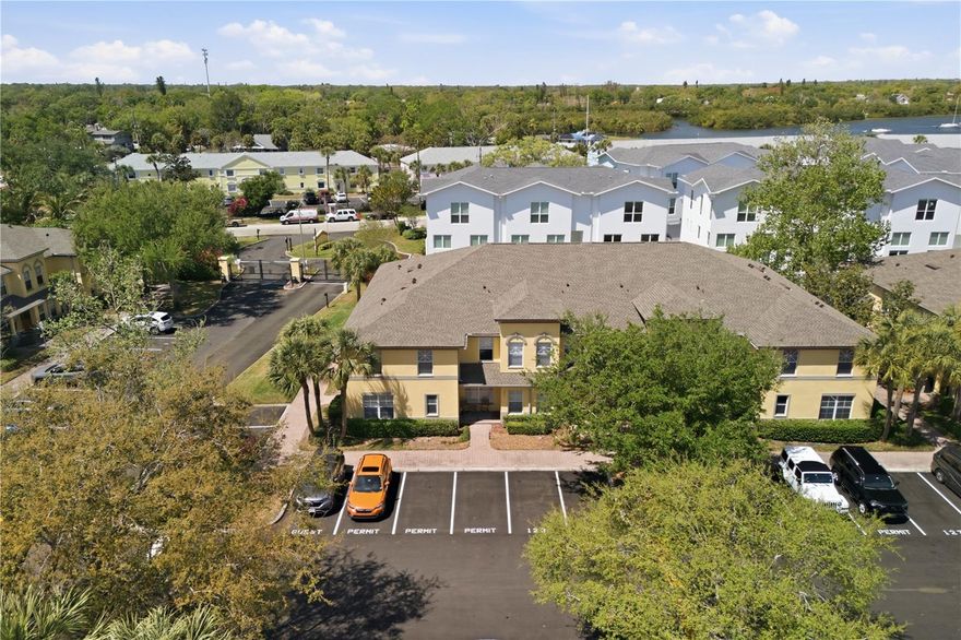 Welcome to Coquina Key Townhomes, a gated and beautifully maintained community in the heart of St. Petersburg. As you step through the front door, you’re immediately welcomed by an abundance of natural light and a thoughtfully designed layout that feels both open and inviting.

The main level is designed for comfortable everyday living and effortless entertaining. The kitchen and dining area are perfectly positioned, flowing seamlessly into the spacious living room. From here, sliding glass doors lead out to a screened-in lanai overlooking the backyard—creating a bright, airy atmosphere and the perfect space to relax. The lanai also features a convenient storage closet for added functionality.

The kitchen is equipped with brand-new appliances, ample cabinetry, and a layout that keeps everything within easy reach. Updated flooring on the main level adds a fresh, modern touch throughout. A half bath and laundry room are conveniently located on the first floor for added ease.

Upstairs, you’ll find a well-designed split-bedroom layout, with the primary suite on one side and the guest bedroom with its own bathroom on the other—providing both privacy and convenience. The primary bathroom has been completely updated with a modern walk-in shower, sleek finishes, and a clean, spa-like design—creating a luxurious and relaxing retreat.. A versatile den provides the flexibility to be used as a home office, guest space, or easily converted into a third bedroom—complete with a Murphy bed for added convenience.

Recent updates include a roof replaced approximately two years ago, brand-new kitchen appliances, updated main-level flooring, and a fully renovated primary bathroom—offering peace of mind and move-in ready comfort.

Coquina Key Townhomes is a well-managed, gated, deed-restricted community ideally located on Coquina Key, just minutes from schools, medical facilities, restaurants, downtown St. Petersburg, museums, and the pier. Enjoy a short drive to some of the area’s most beautiful beaches, including Fort De Soto, Treasure Island, and St. Pete Beach.

The community is pet-friendly and conveniently located near Coquina Key Park, offering a dog park, walking trails, water access, tennis and pickleball courts, basketball courts, and ballfields.

Parking is assigned (#124), with additional permitted parking available for residents, along with ample guest parking throughout the community.

Recent HOA improvements include newly paved and marked roads and parking areas (2025) and a new roof (2023). HOA fees cover a wide range of amenities and services, including a resort-style pool and hot tub, gated entrance with virtual security technology, pest control, water, sewer, trash, exterior maintenance, grounds maintenance, and building insurance, along with contributions to the reserve fund.

This home offers the perfect blend of comfort, flexibility, and location—whether you’re looking for a primary residence, seasonal retreat, or investment opportunity.