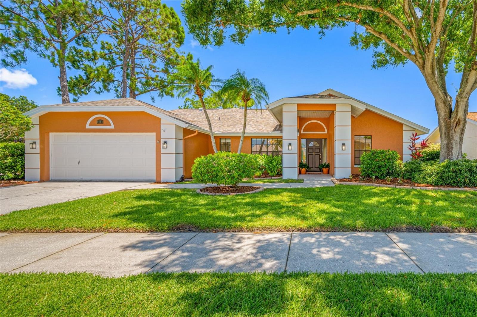One or more photo(s) has been virtually staged. After a picturesque drive into Huntington Trails Community entrance, you arrive at 1111 Chatham Court—a solid block-built home, resting on a lush, wide corner lot. Mature Florida landscaping and flowering hedges frame the attractive exterior, setting the tone for the pride of ownership that defines this highly desirable neighborhood.
**Located in an X Flood Zone, this property currently does not require flood insurance—offering both security and cost efficiency for homeowners.**
Step inside and feel instantly at home. This spacious, sun-drenched layout offers both elegance and comfort, beginning with a formal dining room perfect for hosting. Two generous living areas provide flexibility for entertaining or relaxing—one featuring a cozy wood-burning fireplace that anchors the space with warmth and charm.
The heart of the home is a chef-inspired kitchen with stainless steel appliances, granite countertops, subway tile backsplash, and an abundance of soft-close cabinetry and pull out drawers. A breakfast bar and eat-in nook make mornings easy and inviting.
The split-plan design offers four sunlit bedrooms, including a luxurious primary suite with soaring vaulted ceilings, an oversized walk-in closet, and a private en-suite bath. Thoughtfully updated with sleek, modern finishes, the bathroom provides a spa-like retreat that invites you to unwind in style.
Enjoy the convenience of a spacious, fully equipped laundry and utility room—featuring a full-size washer and dryer and generous cabinetry for storage and easy organization.
In the 2 car garage, take advantage of a generously sized, partially finished attic space—complete with built-in shelving and overhead lighting—ideal for organized storage, seasonal décor, or even a future hobby nook.
Enjoy seamless access to the beautiful, screened-in sparkling swimming pool and expansive covered lanai from nearly every room in the home. Whether you're hosting a weekend gathering or enjoying a quiet morning coffee, this private and inviting outdoor haven not only extends your living space but truly embodies the essence of Florida living.
Rest easy knowing the home’s major upgrades have all been taken care of within the last five years. Noteworthy improvements include fresh exterior paint in 2023 and a full interior refresh in 2025—complete with the removal of all popcorn ceilings. The kitchen is equipped with newer appliances and enhanced by modern lighting fixtures, while the water heater and HVAC system were both replaced in 2024. To top it all off, the roof was updated in 2019, ensuring peace of mind for years to come.
1111 Chatham Court blends comfort, style, and functionality. The Huntington Trails neighborhood in Safety Harbor offers the best of both worlds: proximity to the vibrant downtown, scenic waterfront parks, and miles of bike and walking trails—plus access to top-rated schools. All while enjoying the serenity and pride of a community that truly feels like home.