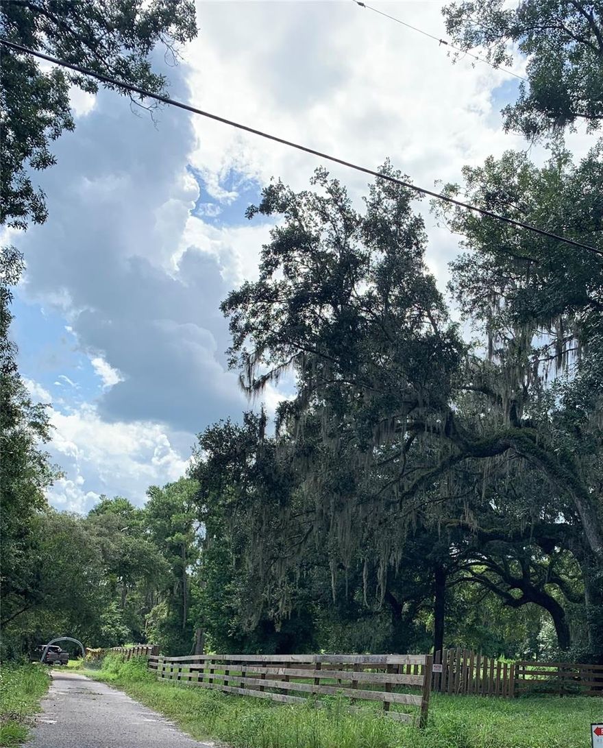 Beautiful wooded property with 2 acres on a dead end road that ends at Neff Lake. Owner may sell an additional 2 acres separately.  Can build a home or place mobile home.  NO HOA or CDD fees. Has well, septic and electric access.  Includes 30 X 21 Pole barn with 1 horse stall and 16 X 14 utility shed with workbench included. Rear of the property has a small creek that runs certain times of the year. Quiet country setting away from the highway but not far from I 75 with 30 minutes to Tampa, 50 minutes to Orlando and 15 minutes from Brooksville.