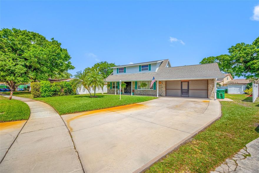 One or more photo(s) has been virtually staged. So many wonderful things about this home.  1973 Original owner.  This home has been lovingly maintained.  Primary bedroom is downstairs with 3 spacious bedrooms upstairs.  One bedroom has an additional space that was the owners sewing room.  It would make a great large walk in closet, home office space, toy room etc.  The backyard is HUGE with patio, would be perfect for entertaining, pets or sports.  Kitchen is light and bright.  Oversized 2 car garage and a shed.  Lawn has a sprinkler system and well.   The location is amazing.  Walk to all 3 Seminole Schools, short drive to the beaches but very high and dry and in a non-evacuation zone.  Many restaurants and shopping at the Seminole City Center just a short drive way.  Don't miss this great opportunity.