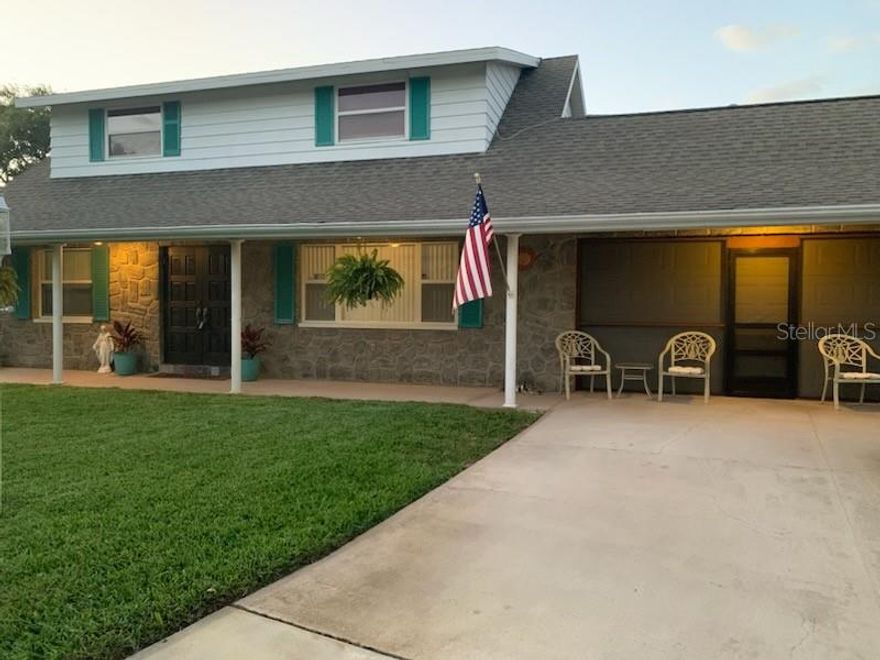 One or more photo(s) has been virtually staged. So many wonderful things about this home.  1973 Original owner.  This home has been lovingly maintained.  Primary bedroom is downstairs with 3 spacious bedrooms upstairs.  One bedroom has an additional space that was the owners sewing room.  It would make a great large walk in closet, home office space, toy room etc.  The backyard is HUGE with patio, would be perfect for entertaining, pets or sports.  Kitchen is light and bright.  Oversized 2 car garage and a shed.  Lawn has a sprinkler system and well.   The location is amazing.  Walk to all 3 Seminole Schools, short drive to the beaches but very high and dry and in a non-evacuation zone.  Many restaurants and shopping at the Seminole City Center just a short drive way.  Don't miss this great opportunity.