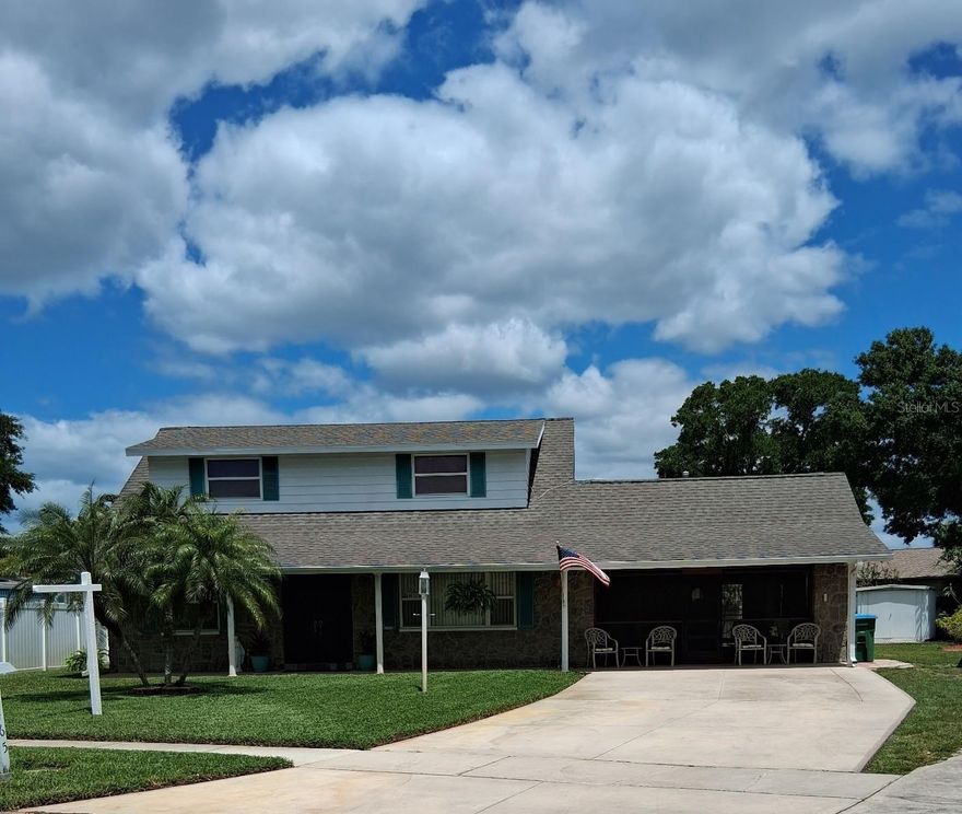 One or more photo(s) has been virtually staged. So many wonderful things about this home.  1973 Original owner.  This home has been lovingly maintained.  Primary bedroom is downstairs with 3 spacious bedrooms upstairs.  One bedroom has an additional space that was the owners sewing room.  It would make a great large walk in closet, home office space, toy room etc.  The backyard is HUGE with patio, would be perfect for entertaining, pets or sports.  Kitchen is light and bright.  Oversized 2 car garage and a shed.  Lawn has a sprinkler system and well.   The location is amazing.  Walk to all 3 Seminole Schools, short drive to the beaches but very high and dry and in a non-evacuation zone.  Many restaurants and shopping at the Seminole City Center just a short drive way.  Don't miss this great opportunity.
