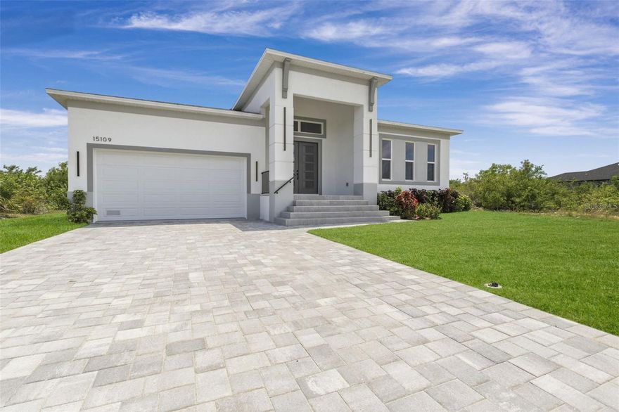 One or more photo(s) has been virtually staged. Welcome to your slice of Florida paradise in the highly desirable South Gulf Cove community—where there is no mandatory HOA and endless opportunities for coastal living. This beautifully designed, move-in-ready home offers 4 bedrooms, 3.5 bathrooms, a 3-car (tandem) attached garage, and 2,660 square feet of thoughtfully crafted living space, perfectly positioned on a spacious lot in a welcoming residential setting. From the moment you enter, you’ll appreciate the impressive 12-foot tray ceilings and expansive open-concept layout, which create a bright, airy atmosphere throughout the main living areas. Elegant 8-foot interior doors, high baseboards, and contemporary trim details add a refined architectural touch. The gourmet kitchen is a true centerpiece, featuring quartz countertops, a large island, stainless steel appliances, a striking central hood, soft-close cabinetry, glass upper cabinets, and a generously sized walk-in pantry—ideal for both everyday living and entertaining. The primary suite is a private retreat, offering direct access to the covered lanai, a spacious walk-in closet with convenient access to the laundry room, and a luxurious en-suite bath complete with a soaking tub, oversized walk-in shower, and a separate water closet for added privacy. Designed with both style and durability in mind, the home features 48"x24" porcelain tile flooring throughout, impact-resistant windows and doors, and construction that meets current flood elevation codes—providing peace of mind for years to come. The expansive four-panel pocket sliding glass doors open seamlessly to the lanai, enhancing indoor-outdoor living. Enjoy Florida living year-round in the outdoor space, with room to add a custom pool (a proposal is available upon request). Whether you're a seasonal resident, investor, or full-time homeowner, this property offers exceptional flexibility—including space for your boat, RV, and golf cart. South Gulf Cove is a vibrant waterfront community offering a clubhouse, park, dock, and sidewalks, with convenient access to nearby boat ramps leading to the Myakka River and the Gulf. Golf enthusiasts will appreciate the abundance of nearby courses, while beach lovers are just minutes from Charlotte Harbor, Englewood and Manasota beaches, Boca Grande, and many more. Easy access to I-75 places Sarasota, Fort Myers, and Naples within comfortable driving distance. As an added opportunity, the adjacent lot is also available under a separate contract. Your Gulf Coast dream home awaits—schedule your private showing today.