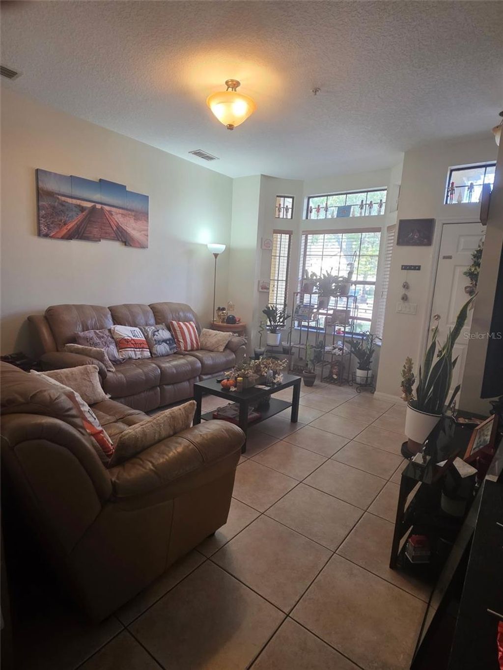 Photo of 6013 Scotchwood Glen #12, Orlando, FL 32822 (MLS # O6365296)