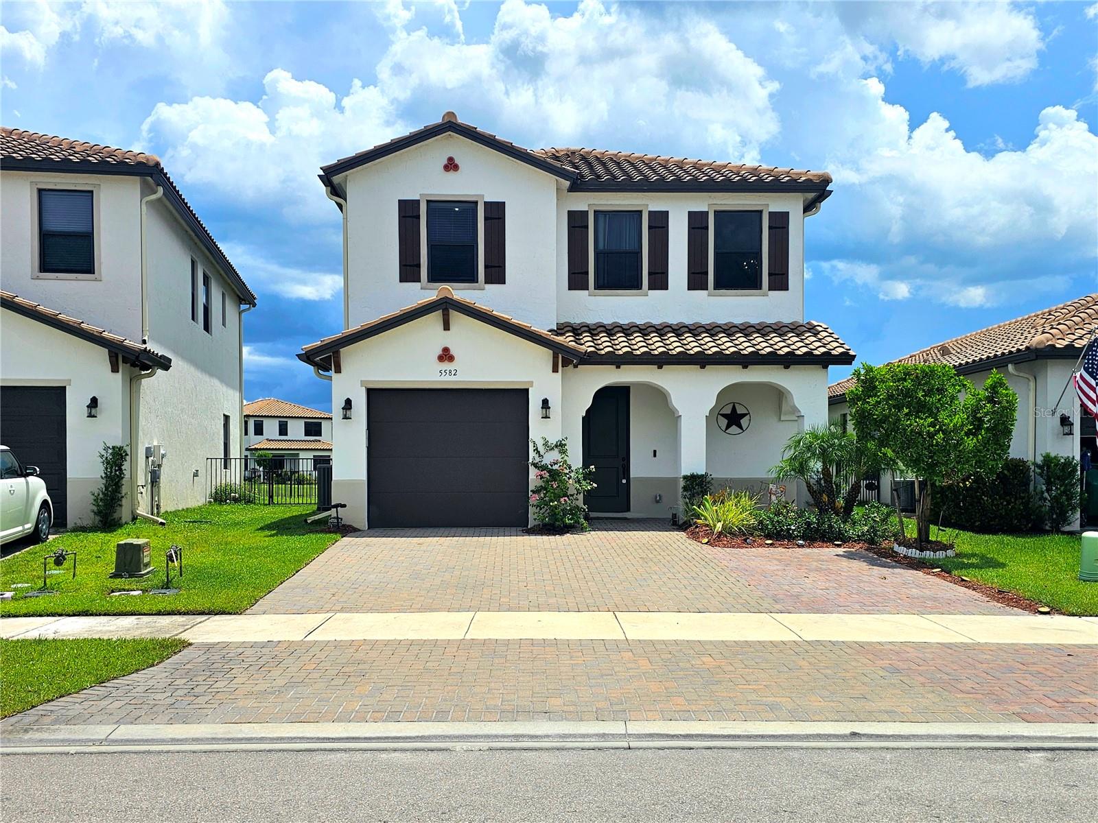 Welcome to the popular Balboa model in the award-winning town of Ave Maria. This beautifully upgraded 3-bedroom, 2.5-bath home offers over 1,900 sq. ft. under air and is situated on a premium lakefront lot with serene sunset views framed by lush banana palms. The home is built for both style and durability, featuring impact-resistant windows and doors, wood plank tile flooring throughout the first floor, and luxury vinyl plank upstairs. The staircase has been upgraded with a sleek metal handrail and round silver balusters, giving a modern and refined feel. The open-concept kitchen offers granite countertops, stainless steel appliances, updated designer light fixtures, and flows seamlessly into the living and dining areas. Additional upgrades include impact-resistant laminate flooring, custom lighting, and recessed hi-hats with smart switch controls. Outdoors, you’ll find extended pavers in the front and back, a screened-in lanai, and an oversized driveway that fits up to three cars. The fully fenced backyard is illuminated with dual floodlights and overlooks the tranquil lake, creating the perfect outdoor oasis. Living in Maple Ridge means enjoying access to Ave Maria’s unmatched amenities. The community clubhouse features a resort-style pool, fully equipped exercise room, conference rooms, a full exhibition kitchen, grill area, and a sauna—ideal for social gatherings and wellness. Residents also have access to tennis courts, a several playgrounds, and brand-new pickleball courts. The town is built for active lifestyles, offering extensive walking and golf cart trails, a family-friendly waterpark, and two large outdoor parks each with dedicated dog parks. Sports enthusiasts will appreciate the four baseball fields and two football/soccer fields available within the community. Convenience is at your fingertips with everything you need located within the town itself. Just minutes from your doorstep are Publix, Ace Hardware, Dunkin’ Donuts, multiple restaurants, medical offices, dentists, eye doctors, and even a nearby gas station and fire station. Education is also a highlight, with Ave Maria University, a well-established middle school, and a brand-new elementary school currently under construction all located within the community. Plus, golf lovers will appreciate proximity to two top-rated courses: The National Golf & Country Club and Panther Run Golf Club. Whether you’re looking for a full-time residence, seasonal retreat, or investment opportunity, this home offers the perfect blend of luxury, comfort, recreation, and everyday convenience in one of Southwest Florida’s most vibrant and fast-growing communities. Schedule your private tour today and experience the lifestyle in Ave Maria.