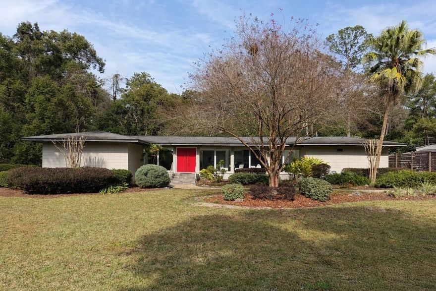 ARCHITECTURAL MID-CENTURY LIVING STEPS FROM UF & SHANDS
.
Located in one of Gainesville’s most coveted and tightly held neighborhoods, this authentic 1966 mid-century modern retreat is just steps from the University of Florida campus and UF Health Shands Hospital. Expansive glass walls fill the home with natural light, creating a calm, design-forward environment in the heart of Gainesville.
.
KEY FEATURES & UPGRADES:
. 
*Authentic 1966 Mid-Century Modern Design
.
*Updated Systems & Finishes for Turnkey Living
.
*3 Bedrooms | 2 Bathrooms | 2,199 Sq Ft
.
*Expansive Glass Walls & Seamless Indoor-Outdoor Flow
.
*Featured in Gainesville Homes Magazine
.
OUTDOOR LIVING:
.
Set on a generous 0.29-acre lot, mature landscaping creates a private natural extension of the living space. The grounds provide an ideal setting for quiet mornings or relaxed entertaining, with ample on-site parking.
.
LOCATION HIGHLIGHTS:
.
Unbeatable proximity to the University of Florida campus, Lake Alice, major sporting venues, and the medical center. Experience everything the area provides for games, events, and amenities—then return home to character and tranquility rarely found this near the city’s core.
.
NOW PRESENTED AT A COMPELLING VALUE IN THIS PREMIER UF-AREA LOCATION