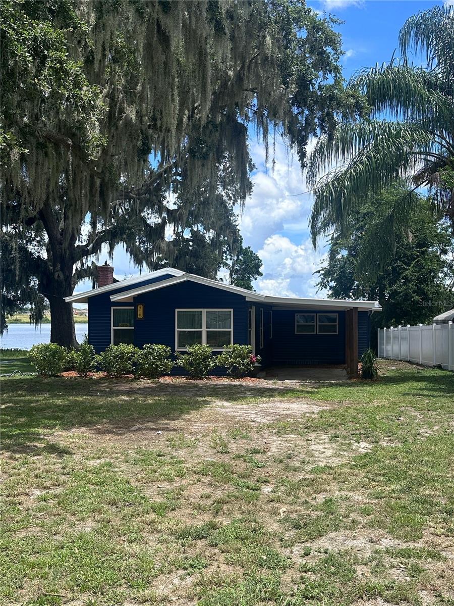 ***Gorgeous Fully Renovated Historical Lakefront Home! No HOA or CDD fees ***
Step into timeless elegance with this beautifully renovated 3-bedroom, 2-bath home situated on a .33-acre lakefront lot with 60 feet of sparkling water frontage. This home blends historic charm with modern luxury, offering an open-concept layout filled with natural light and serene lake views.
The chef-inspired kitchen features granite countertops, a spacious eat-in island, a cozy built-in coffee bar, and stainless steel appliances, all designed for both style and function. Gather around the wood-burning fireplace in the living area, or step out through the sliding glass doors in the private master suite to a covered back deck—perfect for peaceful sunrises and morning coffee or unwind in the evenings with glowing sunset reflections over the lake.
The spa-like master bath offers dual sinks and a lighted, fog-free mirror, while the two additional bedrooms and updated guest bath ensure comfort for family or guests.
Enjoy the outdoors year-round on your covered deck, or take advantage of your lake for fishing, kayaking, or peaceful waterfront relaxation.
Perfectly located to enjoy East or West Coast beaches, Walt Disney World (44 min), Busch Gardens (1 hr 10 min), and the NEW Port 27 waterfront is just one light away. Don’t miss this rare blend of history, modern upgrades, and lakefront living—schedule your private showing today! View the virtual tour here: https://tour.pivo.app/view/adc216c3-11e8-467d-921d-7bd2c17f6f8f