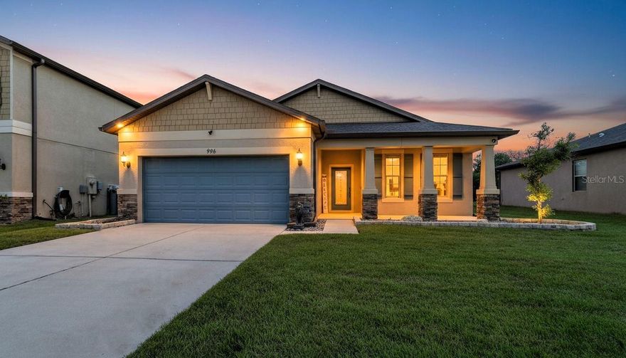 Welcome to this beautifully maintained 3-bedroom, 2-bathroom home with a versatile flex room, located in Trillium. Take advantage of an assumable mortgage at just 2.875%—a rare opportunity for qualified buyers! Step inside to find a bright open floor plan, enhanced by premium luxury vinyl plank (LVP) flooring throughout. The kitchen features granite countertops, stainless steel appliances, and custom brushed nickel hardware on all cabinetry, offering both style and functionality. Enjoy true privacy with NO front or rear neighbors. The backyard overlooks a retention pond, while front overlooks an open field, which is perfect for watching sunsets from your front porch. Watch the sun rise from your screened in back porch while enjoying a cup of coffee. The backyard is fully fenced in with beautiful brick pavers. The extended garage has epoxy floors and custom storage systems. Newer Trane AC. Smart home features include a hardwired Ring doorbell, hardwired Ring exterior cameras with floodlights, and smart lighting throughout for customizable ambiance. This move-in-ready home blends comfort, smart tech, and energy savings in a prime location. Close to the Parkway for a quick and easy commute to Tampa. Trillium offers a beautiful zero entry community pool and a playground! Schedule your private tour today!