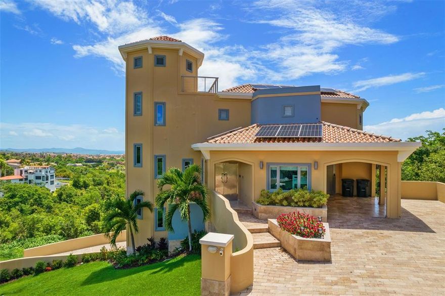 Beautiful Port Road Perfection has hit the market! Spectacular Spanish Estate is located in the exclusive Beach Resort Community of Palmas del Mar on the east coast of the Caribbean paradise island of Puerto Rico. This Spanish Mediterranean- Contemporary style home features an elegantly adorned open floor plan with 5000 sq. foot interior. This contemporary home has all the amenities you can ask for in a Caribbean Dream Home. Featuring a wonderful infinity pool, jacuzzi, and much more for you to enjoy! This is a 5 bedroom, 5 bath dream home being offered fully furnished and equipped. The spacious outdoor area serves as the perfect setting for entertaining friends and family featuring an inground infinity pool and a tastefully manicured landscape. The Home has an attached 2-car garage, full-powered generator, Solar panels, and an elevator are added for comfort and convenience. Palmas Del Mar resort is a master planned, access-controlled community, located on the east coast Puerto Rico. Palmas Del Mar is the most complete resort destination in the Caribbean boasting a range of world-class amenities that are just a golf-cart drive away, such as: - A 60-acre tropical forest reserve - Grocery store, bank, retail stores, restaurants, professional services - Two championship golf courses designed by Gary Player and Reese Jones - World class marina and Yacht Club - The largest Private Tennis Club in the Caribbean with all-new pickleball courts. - First-class Equestrian center with private stables and guided trail rides. - 5 miles of the coast of which 2 miles is beach. - 8 miles of Golf cart paths - Beach club with pools, waterslides, and hot tub Families will have access to The Palmas Academy, one of the finest private schools on the island, which offers English language instruction from Pre-k to 12th grade. Palmas Del Mar is a community like no other.