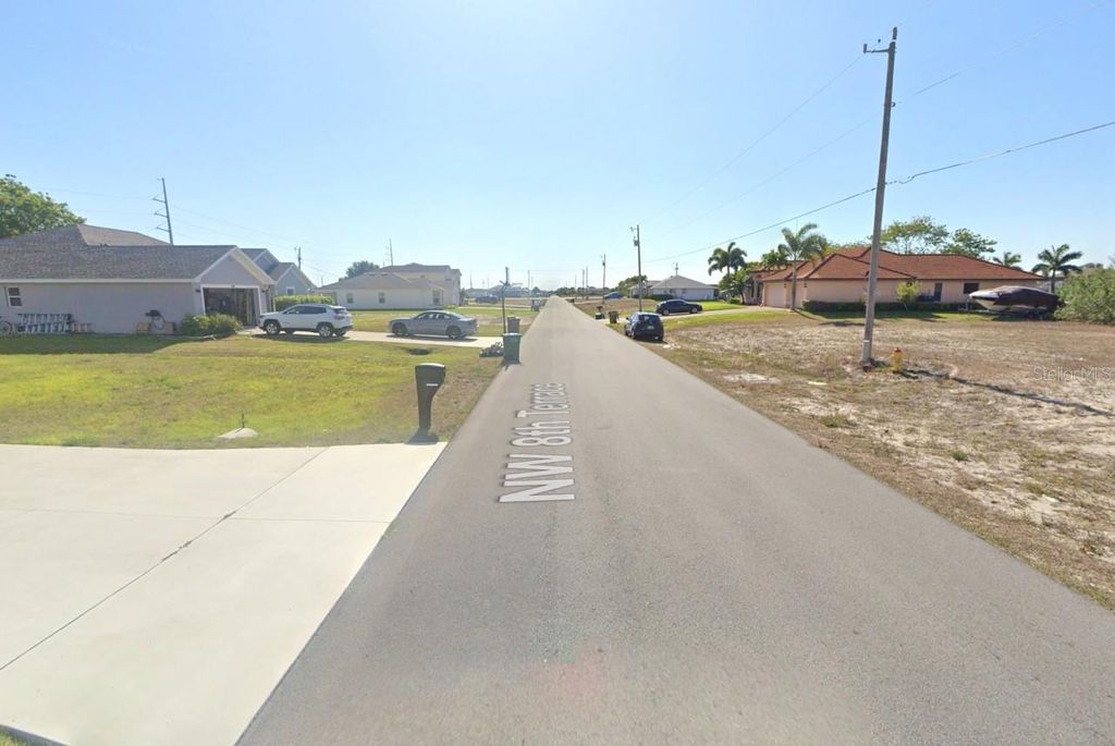 Photo of 701 NW 8th Terrace, Cape Coral, FL 33993 (MLS # O6352936)