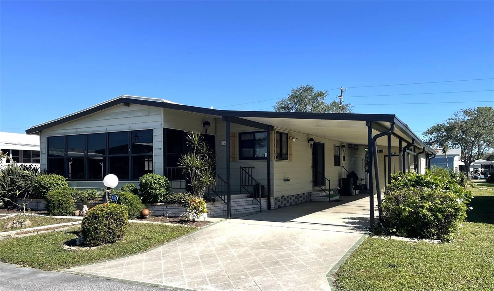 ** SELLER HAS INSTALLED NEW LUXURY FLOORING THROUGHOUT!***DELUXE JACCUZZI TUB ***This 2-bedroom, 2-bath manufactured home in the highly desirable Lazy River Village offers endless potential to create your dream retreat. While some updating is needed, this home features great bones, including an open floor plan with vaulted ceilings. The cheerful Florida room has updated windows and air conditioning, making it a delightful space to relax year-round.
The home boasts exceptional storage options, including built-ins in the living areas, a spacious dedicated laundry room, and a good-sized shed. The guest bathroom has been upgraded with a brand-new walk-in Jacuzzi tub and sits across from a large guest room with a walk-in closet. The oversized master bedroom impresses with two generously sized closets and an en suite featuring double sinks.
Practical upgrades include a whole-house reverse osmosis (RO) system, and a quaint patio area behind the shed provides the perfect spot to enjoy your morning coffee. This home is priced with its cosmetic updates in mind, offering an excellent opportunity to own a home in this premier community and make it uniquely yours.
Lazy River Village is a vibrant, active 55+ community that offers an unbeatable combination of amenities and scenic beauty. Residents enjoy access to a 36-boat slip marina situated on the picturesque Myakka River, perfect for boating and fishing enthusiasts. The state-of-the-art woodshop is a haven for hobbyists, and a wide range of activities ensures there’s always something to do. With walking trails, a clubhouse, fitness center, pool, tennis courts, and beautifully landscaped grounds, Lazy River Village is the ideal place to embrace Florida living at its best.