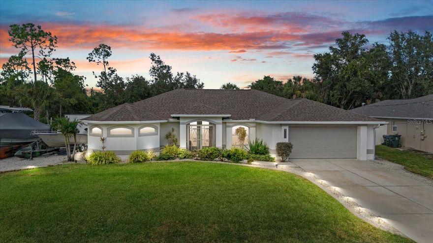 This meticulously maintained home offers the perfect blend of comfort, privacy, and modern Florida living. Featuring 3 bedrooms plus an office, 2 bathrooms, and a 2-car garage, this property sits on a spacious half-acre double lot, providing plenty of room for your boat, RV, or extra storage. Nestled on a quiet street with minimal traffic, yet just minutes from shopping, dining, schools, and I-75, this home offers both convenience and tranquility.
Step inside through the screened front porch and glass double entry doors to discover an inviting open floor plan with porcelain plank tile throughout (2020). The bright living room features vaulted ceilings and triple sliding glass doors that open to an oversized screened lanai and heated salt water sparkling pool, perfect for entertaining or relaxing in your private backyard oasis.
The kitchen offers white cabinetry, stainless steel appliances (2020), a breakfast bar with updated pendant lighting, and ample counter space. The primary suite includes direct pool access, two large walk-in closets with custom shelving (2022), and a spa-inspired bathroom with dual sinks, a soaking tub, and a luxurious walk-through shower. The split floor plan provides two additional bedrooms, each with walk-in closets and upgraded shelving, and a second bathroom with pool access. A front office with 8-foot glass French doors and full wall cabinetry makes working from home both comfortable and efficient.
Additional updates include newer door hardware and blinds throughout, a newer roof (2021), new A/C (2024), whole-house reverse osmosis system (2019), newer pool heater and salt cell (2023), underground sprinkler system, hurricane shutters, gutters around the entire home, decorative curbing with rock landscaping (2022), generator wired to the breaker box, fresh interior and exterior paint (2022) and custom race deck tiled flooring in garage.
This home truly has it all—modern updates, thoughtful design, and the space you’ve been looking for. Move right in and enjoy the Florida lifestyle at its finest.