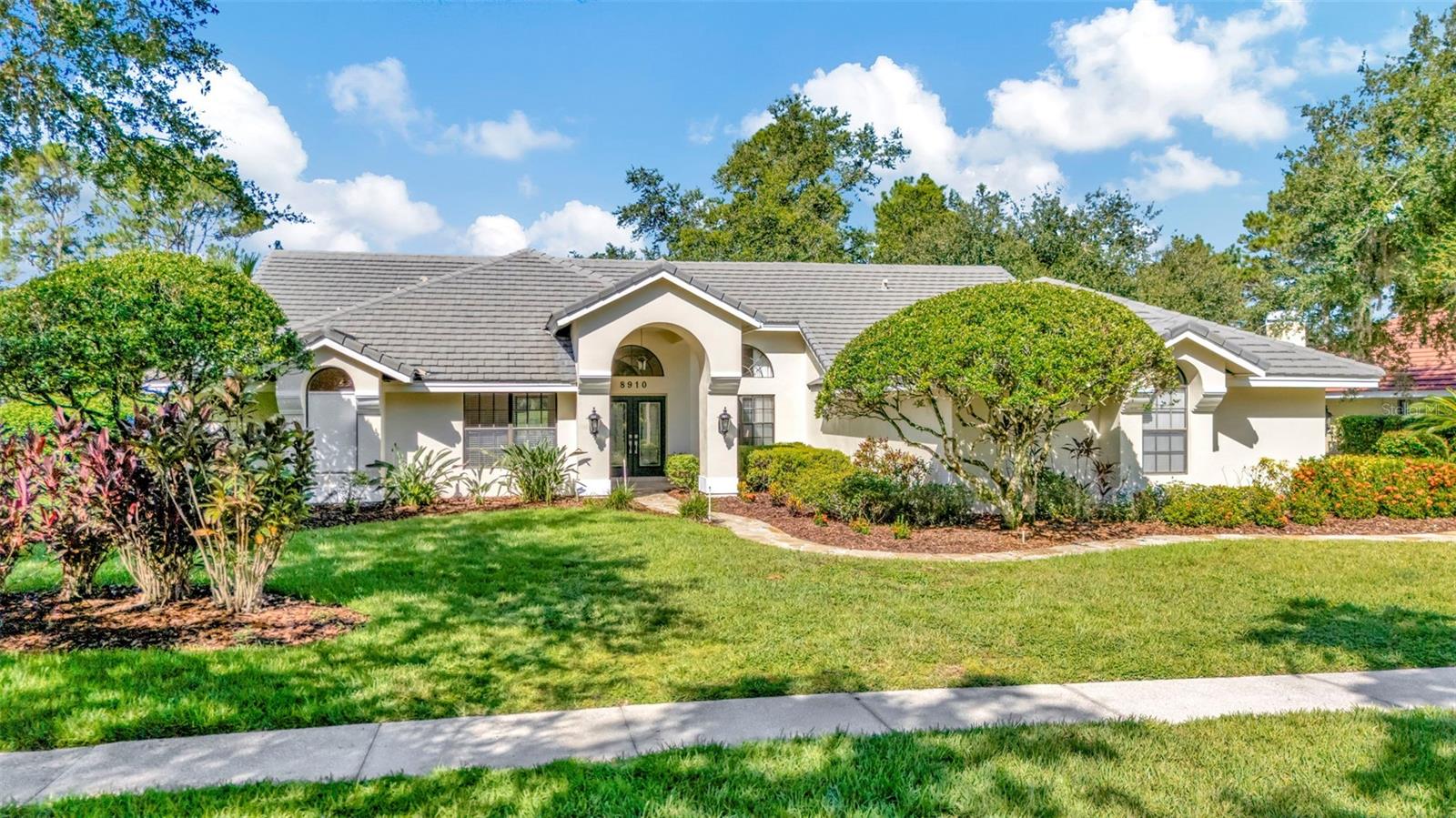 Nestled behind the gates of the coveted Hunter’s Green Golf & Country Club, this thoughtfully updated Bimini model by Rutenberg offers refined Florida living with panoramic fairway views of Hole #2—right from your own backyard oasis. This beautifully updated Bimini floor plan by Rutenberg offers the perfect blend of space, style, and setting. With 4 bedrooms, 3.5 baths, a private den, and 3,374 sq ft of living area, this spacious, open-concept home is ideally situated on a premium golf course lot, providing elegant views of the fairway and green from your private backyard oasis.
The home features travertine flooring throughout, a side-entry oversized 3-car garage, and a freshly painted exterior. The kitchen is equipped with all-new stainless steel appliances, and the fireplace is pre-plumbed for natural gas, ready for your finishing touch. A new front-load washer and dryer are also included.
Additional improvements include a new Carrier HVAC system with replaced air handler and compressor, a dedicated 30-gallon hot water heater for the primary suite, and a secondary 5-year-old water heater for the rest of the home. The pool area features a new cartridge filter system, and the enclosure was rescreened in 2022 with material rated for up to 130 mph winds. Outdoors, you'll find custom-built cabinetry with cedar shelving, super gutters surrounding the pool area, and two separate water meters—one for the home and one for irrigation. For electric vehicle owners, the garage features a 240-volt EV hookup (NEMA 14-50).
This exceptional home is conveniently located near top-rated schools, shopping, dining, medical facilities, and major interstates, offering easy access to everything the Tampa Bay area has to offer. Thoughtful upgrades, timeless finishes, and one of the best golf course locations in the community make this home a must-see. Don’t miss the opportunity to enjoy luxury living in one of Tampa’s most sought-after neighborhoods.