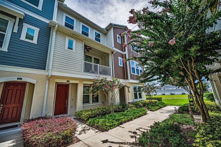 WESTCHASE GEM - Conveniently located in the Heart of Westchase, just a short walk to Westchase Town Center which offers dining, fitness, beauty and entertainment. This gorgeous low maintenance 3 story townhome offers all the benefits of new construction, such as 10 foot ceilings, energy efficiency, recessed lighting, beautiful cabinetry and granite in the kitchen and all bathrooms that give a cohesive modern farmhouse look to the home. Durable luxury vinyl plank flooring flows throughout the entire home and stairways, except for tile in the 3 full bathrooms and newer carpet in the two upstairs bedrooms. Custom plantation shutters provide privacy and sunlight on every window and door to the balcony. The first floor features a flex room that could be used for guests or multigenerational living, as there is a full bathroom on the first floor. Up the stairs, you find wide, spacious open concept living room, dining room and sunny, wall-to-wall kitchen with 42” cabinets and crown molding, a full set of stainless steel appliances and a massive island providing additional storage and plenty of space for bar stools. There is a convenient half bath on that level and serene balcony for enjoying the outdoors. Third level features the impressive primary suite with tray ceiling and large primary bathroom with a walk-in shower, spacious walk-in closet, dual sinks with plenty of counter and cabinet space, along with a private water closet. Also on the third floor is the second bedroom with en-suite bathroom and walk-in closet. The guest bath offers a tub and shower combination with gleaming subway tile and coordinating granite counters and cabinets. The laundry closet is conveniently located on the 3rd floor. Rear entry access to the attached 2 car garage provides comfort and safety from our Florida rains. Additional guest parking lot is located very near the home and the Town Center is just a walk across another parking lot. A rare opportunity for Urban living in the Suburbs!