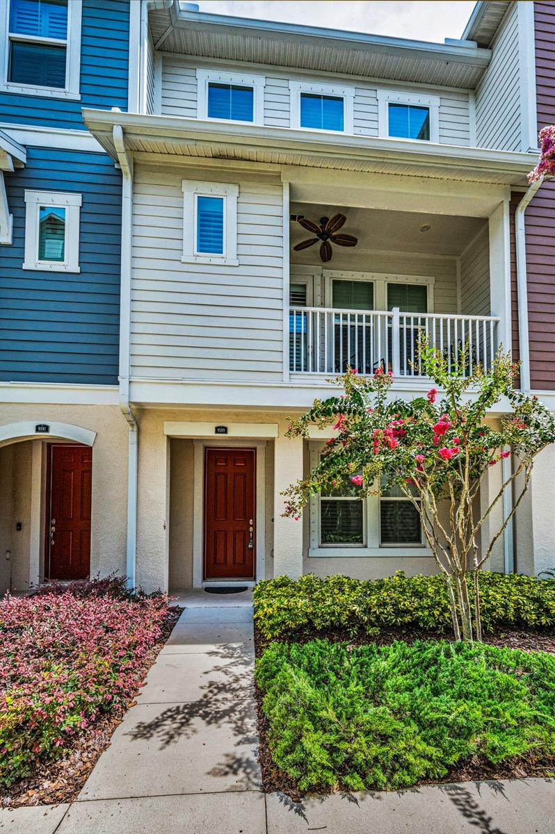 WESTCHASE GEM - Conveniently located in the Heart of Westchase, just a short walk to Westchase Town Center which offers dining, fitness, beauty and entertainment. This gorgeous low maintenance 3 story townhome offers all the benefits of new construction, such as high ceilings, energy efficiency, recessed lighting, beautiful cabinetry and granite in the kitchen and all bathrooms that give a cohesive modern farmhouse look to the home. Durable luxury vinyl plank flooring flows throughout the entire home and stairways, except for tile in the 3 full bathrooms and newer carpet in the two upstairs bedrooms. Custom plantation shutters provide privacy and sunlight on every window and door to the balcony. The first floor features a room that could be used for multigenerational living, as there is a full bathroom on the first floor. Up the stairs, you find wide, spacious open concept living room, dining room and sunny, wall-to-wall kitchen with 42” cabinets and crown molding, a full set of stainless steel appliances and a massive island with additional storage and plenty of space for bar stools. There is a convenient half bath on that level and serene balcony for enjoying the outdoors. Third level features the impressive primary suite with tray ceiling and large primary bathroom with a walk-in shower, spacious walk-in closet, dual sinks with plenty of counter and cabinet space, along with a private water closet. Also on the third floor is the second bedroom with ensuite bathroom and walk-in closet. The guest bath offers a tub and shower combination with gleaming subway tile and coordinating granite counters and cabinets. The laundry closet is conveniently located on the 3rd floor. The attached 2 car garage provides comfort and safety from our Florida rains. Additional guest parking lot is located very near the home and the Town Center is just a walk across another parking lot. Talk about convenience!