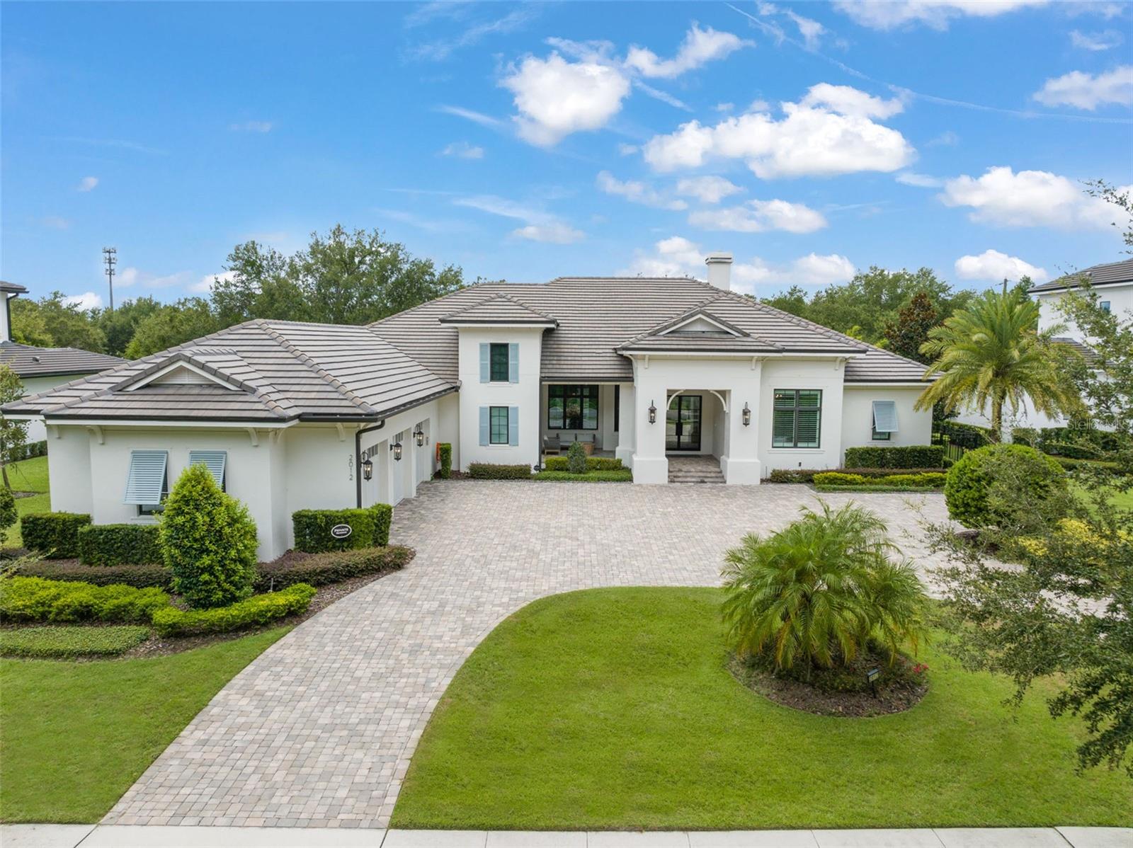 Exquisitely appointed and elegantly packaged former model home, showcasing the pinnacle of perfection, from luxury home builder Element Homes. This masterpiece stands supreme for its high-quality fit and finish and a highly desirable floorplan – featuring a great room combination of family room, dining room, and kitchen – masterfully crafted to exhibit transitional style and function. A wall of glass sliders open to reveal a mammoth covered patio with roller screens, outdoor fireplace, saltwater pool, vanishing edge heated spa, summer kitchen, and detached Casita with bedroom, bath, and kitchenette. With 5 ensuite bedrooms and 4 and a half baths, plus a separate office, and media room with beverage center, rest assured there is room for all. Detailed ceiling beams add a touch of chic elegance. Other highlights include: engineered hard wood floors throughout, vinyl double pane windows and doors, decorative glass entry doors, tankless hot water heaters, spray foam insulation, over-sized circular paver driveway, insulated garage doors and epoxy finished garage floor, rooms individually Nest zoned, ship lap detailed ceilings, quartz countertops, cabinet grade pantry door leading to hide-a-way oversized built-in closet, refrigerator and dishwasher, Thermador appliances, custom shelving and drawers in all closets, great room gas fireplace, rain shower in master shower with beautiful glass enclosure. The Crestron smart wired home allows for Lutron lighting and sound throughout the home. Home sits in a quiet location with just 11 half-acre or larger homesites, walking distance to top-rated Thornebrooke Elementary, and steps away from the border of Windermere. Come experience why this home was the builder’s showcase address.