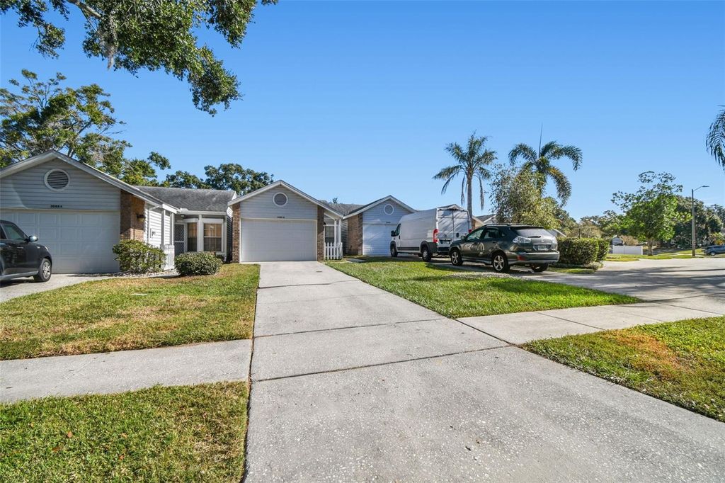 Photo of 3088 Grovewood Boulevard #B, Palm Harbor, FL 34683 (MLS # TB8456349)