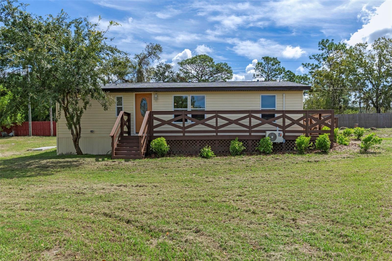 One or more photo(s) has been virtually staged. Stunningly Renovated Home on 1.25 Acres Zoned Agricultural Move In Ready!! Welcome to 18216 Alexson Street, a beautifully updated home offering 1,520 sq ft of living space on a spacious 1.25 acre fully fenced lot. With a NEW 2025 Roof, NEW 2025 AC, and top to bottom upgrades, this property combines modern comfort with the flexibility of agricultural zoning. Inside, you will find brand new flooring, fresh paint, updated trim, stylish fixtures, and an open layout, designed for entertaining and functionality. The chef's kitchen is a true highlight, featuring all new soft close cabinetry, premium stainless steel appliances, sleek new countertops, and a large island with seating that overlooks the dining room and backyard views. The living room boasts cathedral ceilings and abundant natural light, creating a bright and welcoming space. The primary suite offers a generous walk in closet, while both bathrooms have been fully updated with new vanities and matching countertops along with a shower tower spa feature that will leave you mesmerized. Outdoors, you'll love your 1.25 acres of fenced land that provides privacy, space, and endless options. Whether you need room for boats, ATVs, RVs, or other toys, this property delivers the freedom you are looking for. With its extensive updates and versatile acreage, this home is truly move in ready. Schedule your showing today and see all it has to offer. (2025 Roof, 2025 Air Conditioning)