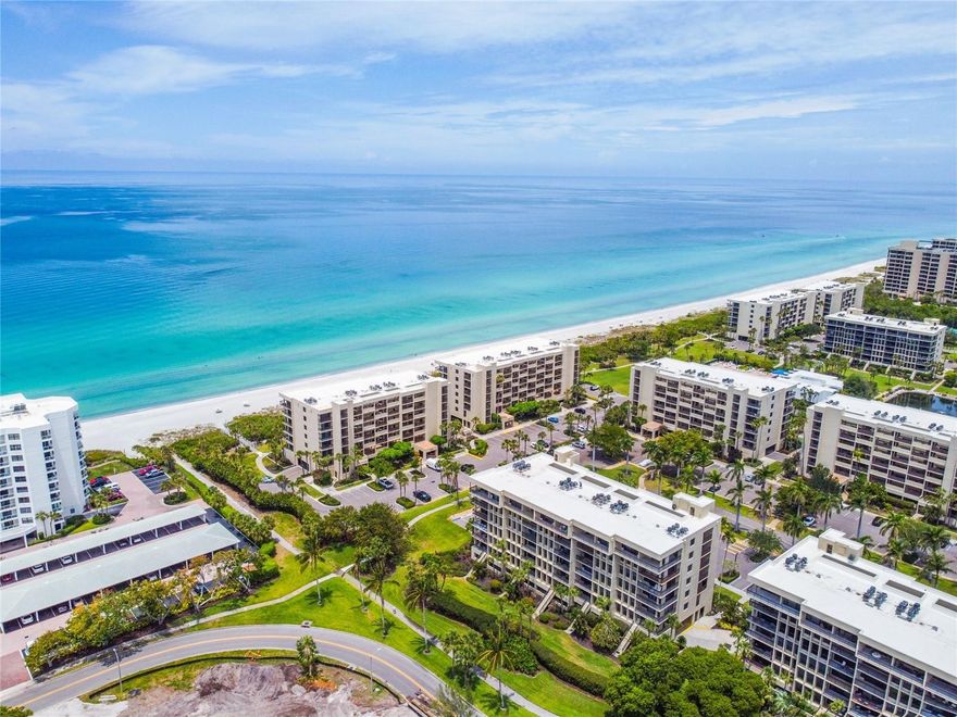 This stunning 2 bed/2 bath residence comes turnkey furnished offering a full view of the Longboat Key Islandside Golf Course and partial views of the Gulf, Sarasota Bay, and the Sarasota city skyline through Hurricane Impact Sliders installed in 2024. The kitchen has been opened up to the living/dining area providing a beautiful view over the golf course greens while owners are creating culinary delights in the kitchen. There is a breakfast bar, a laundry closet, pantry, and plenty of solid wood cabinet space for storage. The primary suite pampers owners with access to the southeast-facing terrace along with a spacious primary bath offering dual vanities, an updated tile shower, and abundant closet space. The split floor plan allows for maximum privacy for both the primary and the ensuite guest bedroom. Other highlights include ceramic tile flooring throughout, stone counters, a coveted underbuilding parking space and an excellent rental policy of 1 month minimum 12 X per year. Beachplace offers a 24-hour manned guard gate, heated swimming pool & spa, tennis courts, dedicated pickleball courts, fitness center, clubhouse, on-site management, and miles of pristine beach to relax, enjoy and explore. Conveniently located on the south end of Longboat Key just minutes from the fine dining and shopping on St. Armands Circle and a short drive over the bridge to the cultural hub of downtown Sarasota.