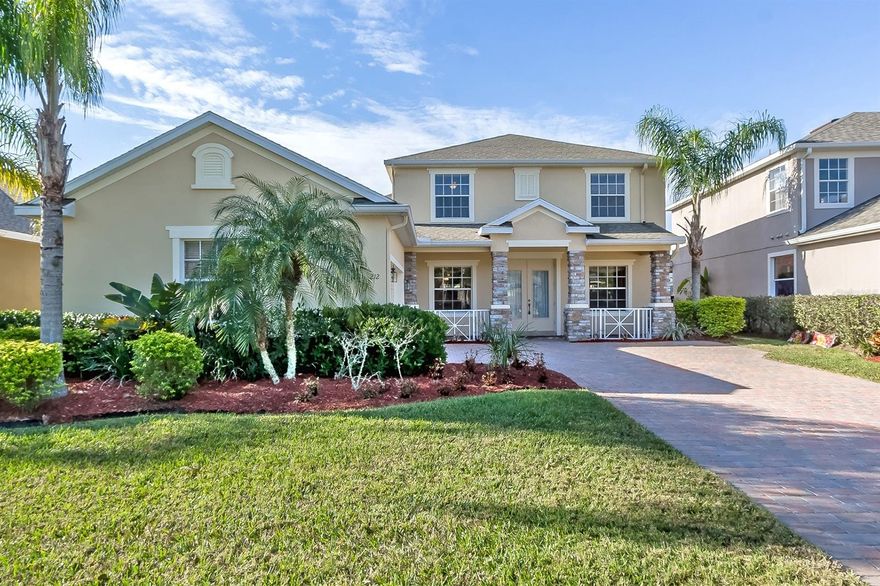 Fantastic, turn-key, LPGA home situated on a beautiful pond with golf course views of the 2nd green on the Legends course in Grand Champion. Open concept on first floor, with formal living room, family room, dining room and breakfast nook. Beautiful views from the kitchen that boasts stainless appliance package, under cabinet lighting, crown molding and island.  First floor master bedroom, with HUGE walk-in closet, and spa like ensuite bath. Bonus room upstairs is perfect for pool table, play & computer area. Larger secondary bedrooms upstairs with fantastic view. Inside laundry, covered front & screened rear porch. Oversized 2 car courtyard garage and paver driveway. ;Water: City