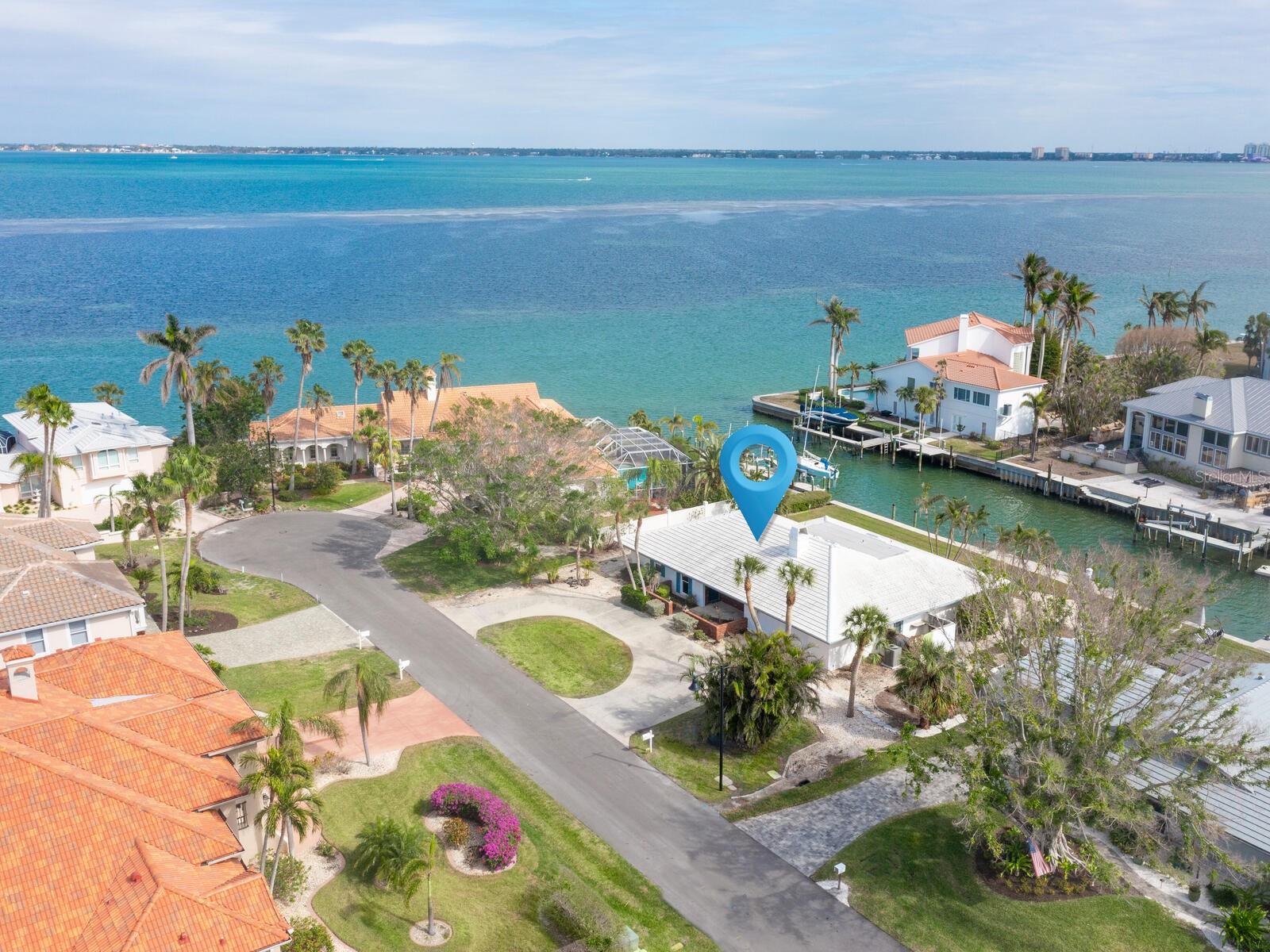 Great opportunity to refurbish per the FEMA plan for LBK or design & build your new Dream Home with the best water views being "1" in from Sarasota Bay, bring serious buyers who love a project !! Revel in the breathtaking Sarasota Bay views. Following a complete remediation from storm Helene this could be an easy renovation to garner a nice seasonal rental while you plan your Waterfront Dream Home This property offers quick access from your new dock to the intercoastal waterway, or the Gulf of Mexico, perfect for a day of fun boating or deep water fishing. This charming masonry home, rich in classic appeal, features two spacious dual owner's suites, a den/3rd bedroom with sliders opening to the patio on the canal, a large great room with a wood-burning fireplace, an adjoining dining room, and an open kitchen. The expansive family room is adorned with walls of windows & some are already Hurricane Impact which boast stunning water views over your private 110 feet of canal with a 2021 built seawall and composite dock. Relish the advantages of living in south Longboat Key, with all it has to offer, including a private deeded beach.