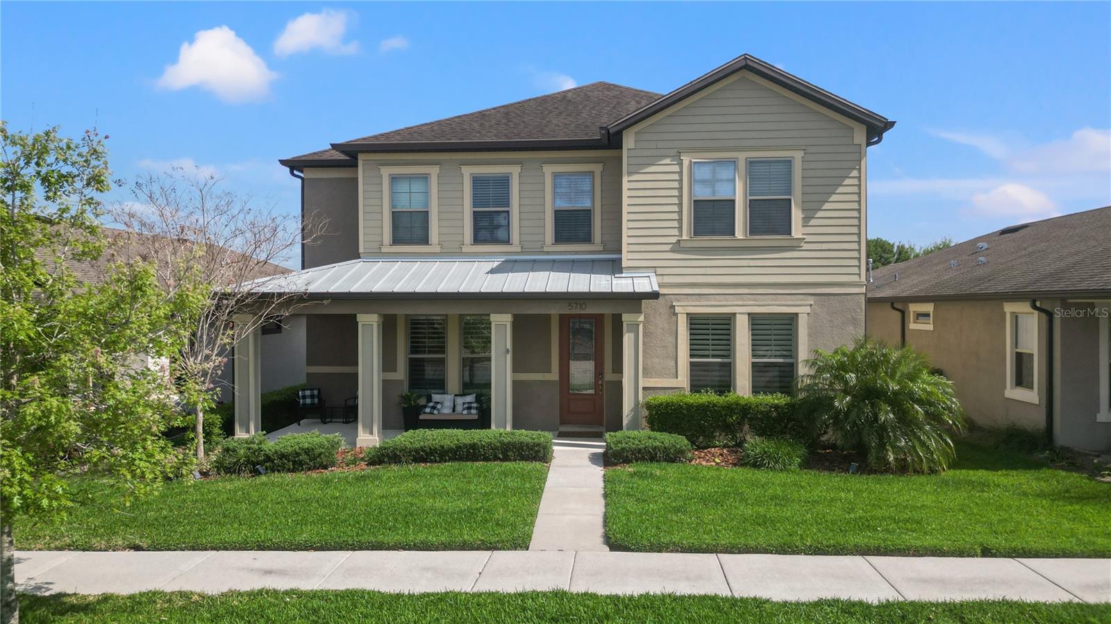 This beautifully maintained home features all of the bells and whistles and is located in the amazing community of Fishhawk Ranch West! The home offers 2903 square feet of living space with 4 bedrooms and 3.5 bathrooms with the always popular first floor guest suite. As you approach the front door you will notice a large covered porch with plenty of room for patio seats or rockers. Upon entering the home your eyes are drawn to the lovely laminate flooring and plantation shutters throughout the first floor. You will find a formal dining room to the right which can be used for dining entertainment, office, media room, or even a pool table, and a half bath/powder room to the right. To the left is a huge walk-in coat closet. The gracious foyer welcomes a beautifully designed open floor plan that includes a spacious kitchen, dining area and family room. The kitchen has an over-sized island with room to seat 4-5 comfortably, an abundance of 42” solid wood cabinets, granite countertops, upgraded stainless steel appliances, recess and pendant lighting for as little or as much light as you want in the kitchen, including under the cabinet lighting, and a spacious walk-in pantry. An added exciting feature includes a butler pantry with butcher block countertops and a wine cooler. A dining area large enough for a full dining room table with pendant lighting above, is located between the kitchen and family room. The spacious family room is equipped with a coffered ceiling, custom built-in entertainment center with an electric fireplace, and triple sliders that open to a paver and screened lanai with sun shades and a ceiling fan. Also located on the first floor is an office nook perfect for in-house office space or homework, and the generous sized guest bedroom with an en-suite bathroom. Upstairs there is a bonus room perfect for a media area or playroom with a walk-in closet for storage. The owner’s suite has a tray ceiling, huge walk-in closet, an en-suite bathroom with dual vanities, and a luxurious walk-in shower. There are two additional bedrooms upstairs and another full bathroom that separates the shower/tub and toilet area from the vanity area. Perfect for teens who need to share a bathroom! The laundry room is equipped with a sink and cabinets and is conveniently located upstairs. Additional features of this amazing house include tall doors and high ceilings, a brand new tankless water heater, an owned water softener, ceiling fans in all rooms, overhead storage rack in the garage, and an abundance of storage space! Zoned for A-rated schools, FishHawk Ranch West is a resort-style community that offers amenities including a heated lap pool, a 3 foot zero entry pool with a splash pad and small slides, playgrounds, two dog parks, a Lake House with a shaded walking trail around the lake, fitness center, game room, basketball court, and miles of walking and biking trails. In the neighborhood you will find a Publix, pet grooming, pediatrician, dentist, nail shops, a bagel shop, and the elementary and middle schools. Within driving distance to shopping, downtown Tampa, McDill AFB, golf courses and infamous beaches. Make your appointment to see this beautiful house and community!