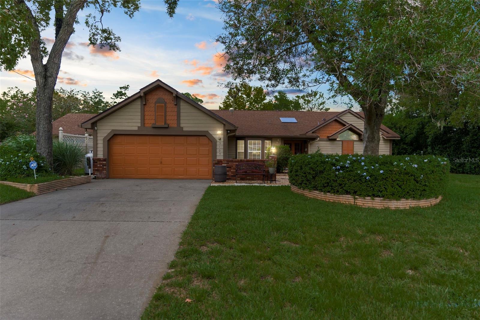 Preferred lender offering a credit on this unique home!
Welcome home! This beautifully maintained 3-bedroom, 3-bathroom pool home with sunroom and bonus room sits on a spacious 0.7-acre lot bordering Oak Hills Golf Course. Enjoy golf course living with NO HOA—this home truly feels like your own private resort.
Step through the foyer into a bright living room with vaulted ceilings, skylights, and an open, inviting feel. The thoughtful split floor plan provides both comfort and privacy, with the primary suite tucked away in its own wing. A bonus room, formal dining room with pool view, cozy dinette, and an oversized sunroom with ensuite bath and wheelchair-accessible drive-in shower provide versatile spaces for living and entertaining.
With over 2,800 square feet of living space and over 3,600 square feet total, this home is ideal for gatherings, working from home, or hosting loved ones. Throughout, you’ll notice thoughtful details like wall molding, accent lighting, and ceiling illumination that add warmth and character.
The kitchen blends elegance and function, featuring soft-close cabinetry, a water line above the cooktop, a built-in convection oven/microwave combo, panel-ready dishwasher that blends in with the cabinetry, and easy access to both the dining and living areas.
Recent updates include a new roof (2021), solar-powered 80-gallon water heater (1–2 years old), and upgraded cabinetry. Additional features include durable vinyl flooring with scratch-resistant coating, professionally maintained carpets, tinted windows, and air returns in every room for enhanced efficiency. The home is also equipped with a generator—perfect for storm season. For added comfort, enjoy both a propane gas fireplace in the living room and an electric fireplace in the sunroom.
Step outside to your backyard retreat. A screened-in 8-foot-deep pool with diving board and spa awaits, surrounded by lush landscaping and overlooking the golf course. With two attached garages (three total parking spaces), an extra side parking area, and a storage shed, you’ll have plenty of room for vehicles, hobbies, and toys.
This home offers the best of both worlds—relaxing golf course views with no HOA restrictions, plus a pool and spa that make every day feel like resort living. Don’t miss your chance—schedule your private showing today!