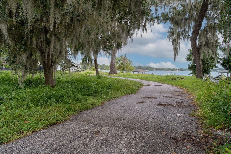 Rare Lakefront Vacant Lot in Belle Isle – Ready to Build
Exceptional opportunity to build on a cleared lakefront lot in the highly desirable City of Belle Isle. The prior home has been demolished, and the lot is construction-ready. The existing dock and covered electric boat lift remain, offering direct access to the Lake Conway Chain of Lakes, a spring-fed boating and recreation destination.
Because a residence previously existed, the buyer may qualify for reduced impact fees (buyer to verify). Lakefront vacant lots in this area are extremely rare, making this a prime waterfront opportunity.
Buyer is responsible for verifying all building requirements, including setbacks, measurements, zoning, permits, and overall feasibility with all applicable authorities.