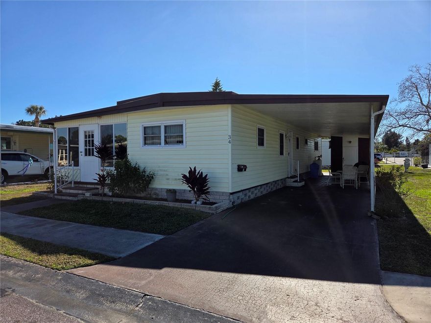 This 2 bed 2 bath doublewide is located in Greenbrier Village a 5 star 55+ Resident Owned Community.  The home has vinyl siding, metal roof, central HVAC system (with heat pump), storage she (with washer & dryer), water softner system, carport, 3 car driveway & a Florida room on the front of the home.  The inside of the home has a split floor plan the spare bedroom with en suite bathroom is located at the front of the home.  The master bedroom and main bathroom is located at the rear of the home. There is a pass through kitchen with laminate countertops and a stove as well as a refrigerator.  The dishwasher does not work.  The community amenities include: Clubhouse, Laundry, Lobby (Key Required), Maintenance, Pool & a Shuffleboard Court. The HOA fee is $230 a month which includes: Common Area, Pool Maintenance, Grounds Management, Private Road, Taxes, Sewer, Trash, Water & an Escrow Reserves Fund.