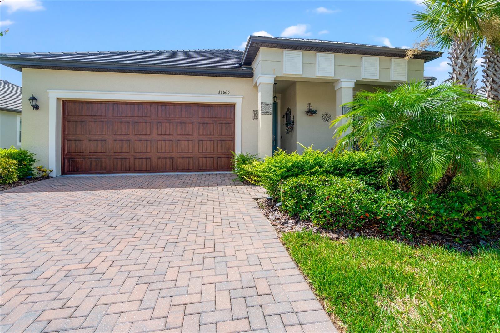 Welcome to resort-style living in the 55+ community of Mirada! This 2 bed, 2 bath + den single-family home offers low-maintenance luxury with an open layout, luxury vinyl plank flooring, and a sleek kitchen featuring solid surface counters and stainless steel appliances. Enjoy your morning coffee on the screened lanai or take advantage of Mirada’s incredible amenities including the lagoon lifestyle, fitness center, trails, and social clubs. Meet neighbors at weekly events, happy hours, and fitness classes there's always something happening. It’s more than a home it’s a connected, active community where friendships flourish. With a 2-car garage and modern finishes, this home blends comfort and convenience in one of Pasco’s premier active adult neighborhoods.