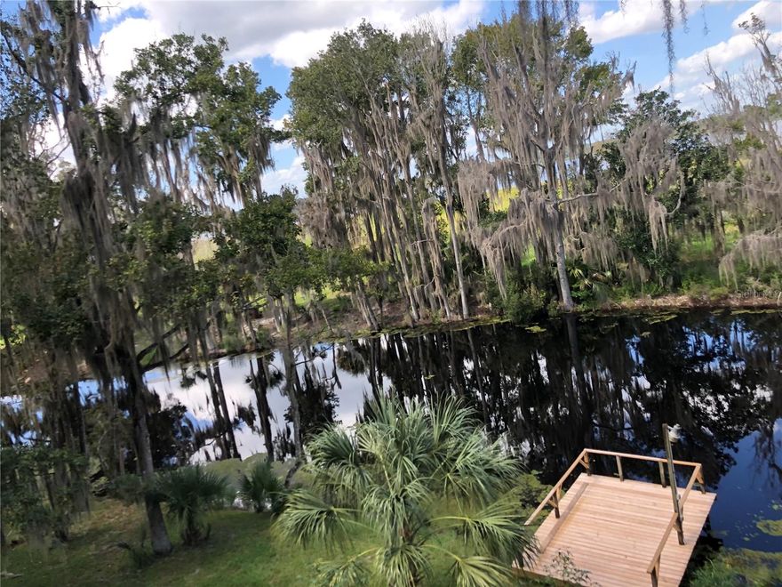 Serene Nature Retreat on 3 Acre Waterfront Property  – $147,000

Nestled on a sprawling 3 acre lot, this unique property offers the perfect blend of natural beauty and outdoor adventure. With 120 feet of cleared frontage on a tranquil canal that extends to Little Orange Lake, you'll have direct access to peaceful waters and stunning views. The canal frontage has a wooden dock that is perfect for fishing, relaxing, and soaking in the surrounding wildlife and serene atmosphere.

The property is shaded by an abundance of native Florida trees, including majestic oaks, palms, and striking magnolias, creating a lush, private oasis. Enjoy having a variety of fruit trees including orange, grapefruit, and persimmon trees.    Whether you’re enjoying the open wooden deck with canal and lake views or exploring the expansive grounds, you'll be surrounded by the beauty of nature at every turn.

The front 1 acre property has a perfect place to have your custom built home.  The property is also equipped with a well and septic system, adding to its appeal as a self-sufficient retreat. Irrigation system is an added feature to this thoughtfully designed property. Create a new homesite or embrace the minimalist living.  The property extends through the canal to cross over more land to additional lakefront property....let the adventure begin.

Located just a short drive from Gainesville, you’ll be able to attend all the University of Florida games and events, while still enjoying the peace and quiet of country living. With easy access to Ocala and Palatka, this property is ideally situated for those who enjoy a mix of outdoor recreation and urban conveniences.

Priced at $147,000, this is a rare opportunity to own a piece of Florida paradise. Don’t miss out on this waterfront gem!