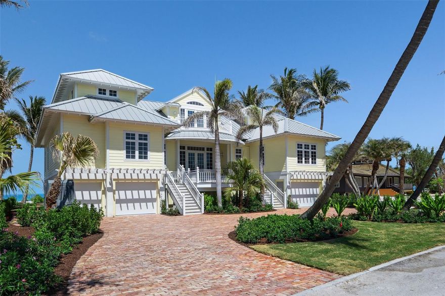 Welcome to a truly exceptional retreat, nestled perfectly between Charlotte Harbor and the pristine shores of the Gulf of Mexico. This stunning Gulf-front residence epitomizes coastal living, offering a seamless blend of traditional elegance, modern sophistication and communion with Boca Grande’s Old Florida lifestyle. The generous 1.16- acre lot which includes ownership of the adjacent eastern lagoon is situated on one of the Islands premier private roads improved with only gulf front homes and exclusive beach access.  This traditional coastal-style residence is complete with 5 bedrooms and 6.5 baths and its custom construction is a true masterpiece of design and craftsmanship. The spacious and open floorplan provides breathtaking Gulf or Harbor vistas from almost every room and all three levels of the residence are accessible by stairs or elevator which are in close proximity to both garage facilities. The gourmet kitchen is beautifully outfitted with custom wood cabinets, twin Sub-Zero refrigerators, Sub-Zero beverage drawers, Wolf cooktop, double ovens and a multitude of fine custom finishes.  The main living floor also includes a luxurious primary bedroom with separate dual baths, large custom closet and direct access to an elegant den/office. The second living level includes three generously sized guest suites, each with their own bath, as well as a second laundry room, a study, and a comfortable living room with gorgeous waterfront porches. The residence enjoys a refined aesthetic complete with beautiful hardwood floors, smooth drywall finishes, faux painting, custom built-ins and beautiful wood moldings all of which are enhanced by the properties whole house Lutron lighting system. The grounds are beautifully landscaped and   highlighted by an in-ground pool and private beach access. This stunning outdoor Oasis is perfect for serene quiet time, family gatherings and entertaining friends.  This Boca Grande gem is more than just a home; it's a lifestyle. With its prime location, stunning views, and unparalleled craftsmanship, this beachfront estate presents a singular opportunity to own a truly exceptional piece of Gulf Coast luxury.