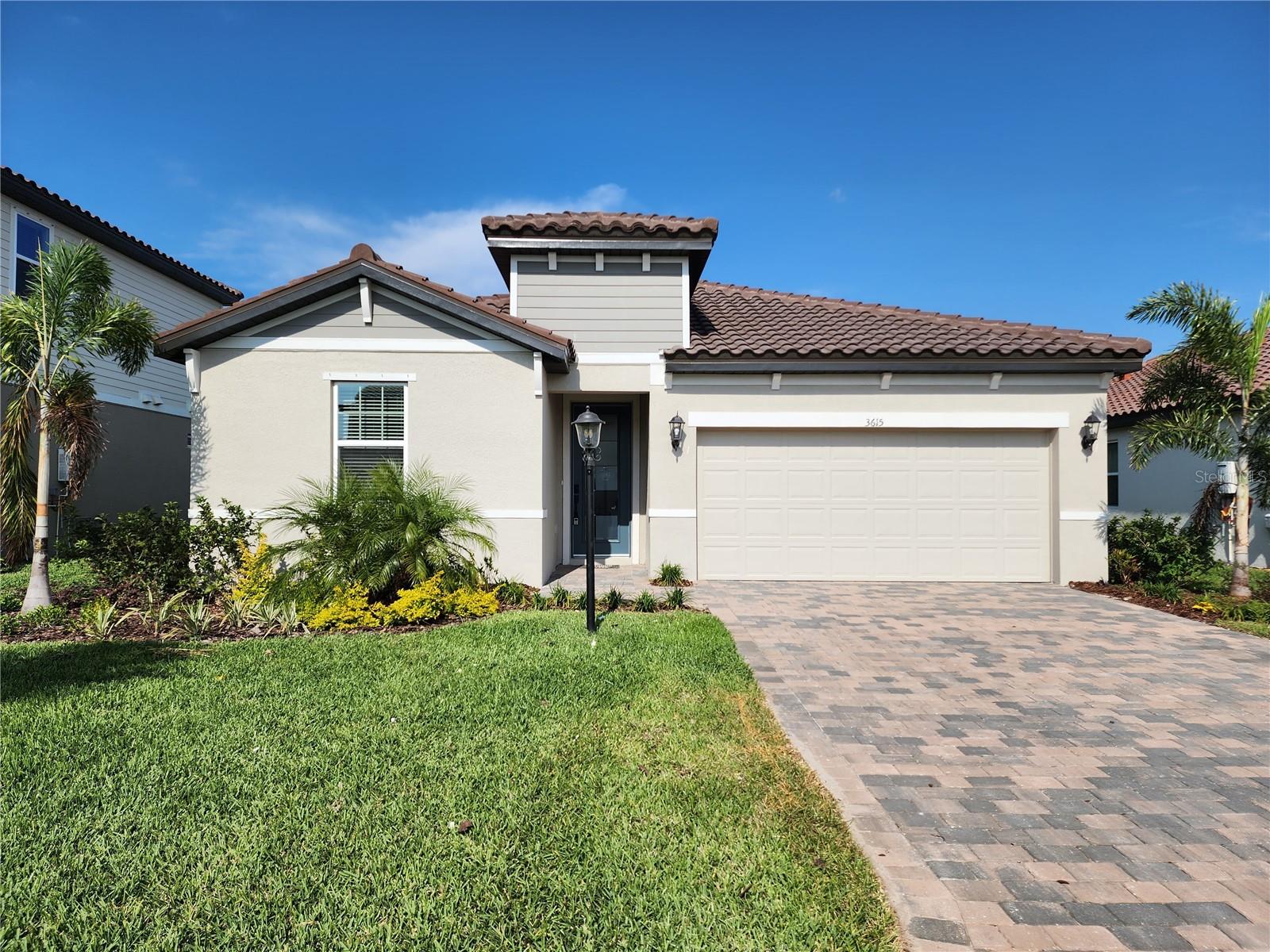 For Rent! Pet Friendly! Unfurnished Annual Rental! This built in 2022, 4 bedroom 2 bathroom lakefront home, in the gated new development of Savanna at Lakewood Ranch, is absolutely gorgeous both inside and out! The lake views are amazing from the screened lanai in the back. This home offers great space on the inside with an open floor plan with plenty of natural lighting that flows the living room, kitchen, and dining room all together. The kitchen boasts stainless appliances, a gas stove, a large pantry, and an island with eating space. The bedrooms are set up on a split floor plan so, 2 of the bedrooms are on the left side of the house just inside the front door and the other 2 are on the right leading towards the back of the home. The master has plenty of space for all of your bedroom furniture and features an ensuite bathroom with dual vanity sinks and a walk-in shower. Through the ensuite you will also find the huge walk-in master closet. The other 3 bedrooms share a bathroom that is found in the hallway between the first 2 bedrooms. Washer and dryer included with property. The community offers a basketball court, community gym, community pool, dog park & playground. Ceiling fans have been added to the master bedroom and living room since photos were taken.