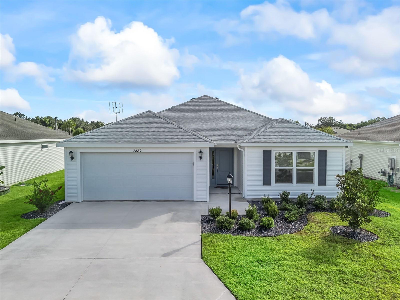 Move-In Ready, recently built in 2023, practically brand-new home. Turnkey optional, so just bring your toothbrush and start living the lifestyle you’ve been dreaming of and enjoying everything The Villages has to offer. Vibrant golf cart community with easy access to shopping, dining, and entertainment. With 3 bedrooms, 2 bathrooms, and a 2-car garage, the layout and open floor plan are not only functional but also inviting and great for entertaining. The primary suite boasts a stylish tray ceiling, large walk-in closet and en-suite bathroom with double sinks. The kitchen is a great workspace that features STAINLESS STEEL appliances, solid wood cabinetry with convenient roll-out shelves, soft-close doors and drawers. Whether it’s a morning round of golf or a day of enjoying your favorite activities, unwind on the screened lanai that has a pond view and no rear neighbors, or enjoy the free nightly live entertainment at one of the town squares or nearby Sawgrass Grove. This like new home offers the perfect balance of activity and relaxation so call now to schedule your private tour today!