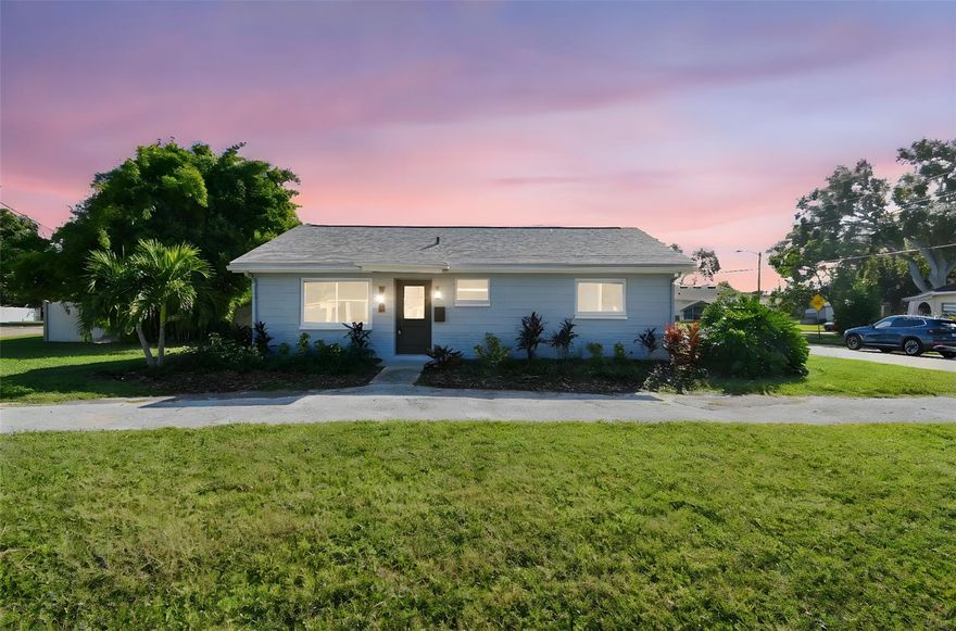 Private Oasis in Highly Desired Edgemoor Neighborhood! Situated on a tropically landscaped, rare to find oversized corner lot (11,430 sq/ft), this 2,400 sq/ft beautifully updated one-story home includes 5 bedrooms, 3 bathrooms with an expansive outdoor entertainment/gardening space plus access for RV/Boat parking and room for a pool. This exquisitely updated, move-in-ready home was purposely designed to be both stylish and energy efficient with superior block construction, newer roof with upgraded shingles(chosen for durability and energy efficiency 2020), impact resistant windows and doors (2022) plus a Solar Power electric system with warranty and Tesla backup battery. The solar system is fully owned by the Seller and allows for a  low monthly electric cost. A brand new 2025 designer kitchen is a chef's delight and showcases gleaming quartz countertops, soft-close wood cabinetry, sleek stainless steel appliances, designer backsplash, durable stainless steel sink, wood look porcelain tile floors, a convenient walk-through pantry/coffee bar, plus an abundance of storage making the kitchen a true centerpiece for everyday living. Entertain family and friends in the light filled great room that flows effortlessly to the outdoors through French doors, creating seamless indoor-outdoor living. The split floor plan offers privacy for the tranquil primary suite and is a spacious calming retreat featuring double closets and an updated en-suite bath with additional storage space. Step outside to your private urban garden oasis, complete with raised garden beds, wall herb garden, hand-painted tropical mural, and a rainwater-fed drip irrigation system, perfect for those who love sustainable living. Enjoy dining alfresco and savoring tropical breezes in the covered outdoor bar area with power, lighting, overhead fans, and TV hookup. Rounding off the outdoor space is a PVC fenced yard, two storage sheds (8x14 and 10x14) and a circular driveway with ample parking. Three spacious bedrooms with generous sized closets and two additional spa-like baths offer a flexible use floor plan and a fifth bedroom serves as a bonus space, ideal for a home office, gym. A dedicated laundry room with extra storage adds additional convenience as well. Located close to 4th Street featuring grocery stores including Publix, Fresh Market, restaurants, gyms as well as close to schools and parks.