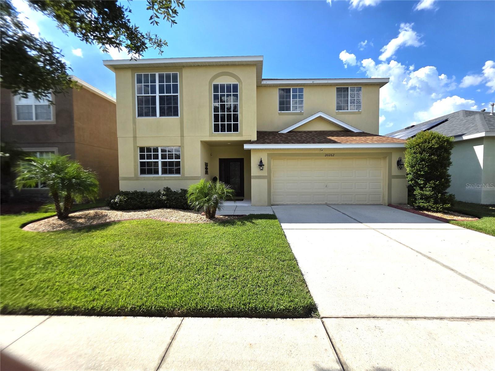Stunning and move-in-ready, this beautifully updated 4-bedroom, 3-bath, 2-car garage home with a spacious loft offers over 3,000 SF in one of Tampa’s most desirable guard-gated communities. The kitchen and all bathrooms have been completely renovated since 2021, showcasing Quartz countertops, modern fixtures, and high-end finishes. Major improvements include a new roof (2023) and both AC units replaced in 2022 for reliable, energy-efficient comfort. In 2023, the entire first floor was upgraded with elegant porcelain tile flooring, while the second floor was fully renovated with new flooring and custom stair and upper-level railings, enhancing the open-concept design. The chef’s kitchen features Quartz counters, stainless steel appliances, a seamless sink, 42” cabinets, a large island, and a breakfast bar that opens to the family room and screened lanai with peaceful conservation views. Freshly painted interiors (2023) create a bright, inviting atmosphere throughout. Step outside to your own private retreat with a travertine pool deck renovated in 2022, offering a clean, luxurious surface that stays cool underfoot. The saltwater pool includes a new filter and water heater (2025). Additional highlights include soaring ceilings, an open loft, hurricane-grade mirror-tinted windows, a radiant barrier roof, upgraded backsplash, and designer lighting throughout. The flexible first-floor bedroom is perfect as an office or in-law suite, while the spacious master retreat features a private sitting area and a spa-style bath with garden tub, walk-in shower, double vanity, and Quartz counters. Located in a resort-style community with 24/7 security, Olympic-size pool, water playground, clubhouse, fitness center, sports courts, playgrounds, and scenic trails—this home combines luxury, comfort, and location in one incredible package!