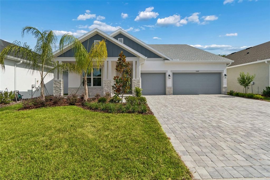 Photo of 31467 Hayman Loop, Wesley Chapel, FL 33545 (MLS # TB8481612)