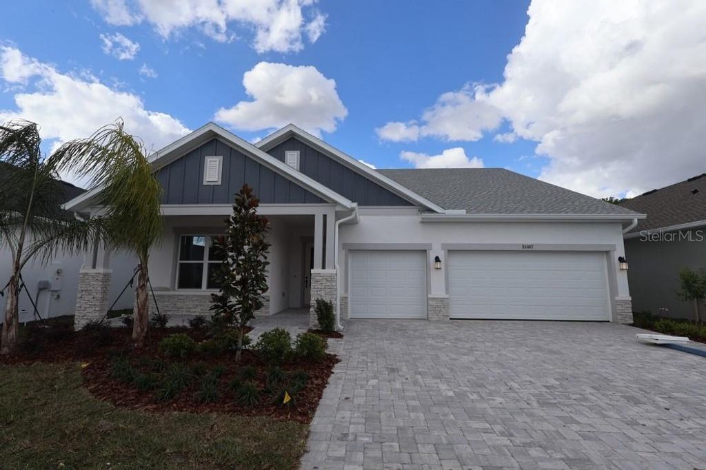 Photo of 31467 Hayman Loop, Wesley Chapel, FL 33545 (MLS # TB8481612)