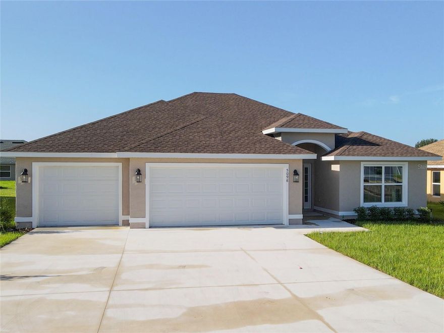 ONE OF A FEW NEW HOMES SELLER HAS REMAINING! PRICE REDUCED AS SELLER WANTS HOUSES SOLD BY END OF THE YEAR!! NEW CONSTRUCTION HOME IN SW OCALA COMMUNITY!! - Completed and ready 3 BR, 2 BA with spacious 3-Car Garage! Nearly 1800 Living SF, CBS construction. Open concept, split bedroom layout, Owner's Suite w/vaulted ceiling, bath with dual sink vanity, enlarged glass-enclosed tiled shower, big walk-in closet. Open kitchen, wood cabinets, granite counters, stainless steel appliances incl. range, dishwasher, and microwave. Great room with vaulted ceiling, dining area w/double glass sliding door to covered patio, & inside laundry. Other features include lights/fans, luxury vinyl plank flooring in main areas, tile in the bathrooms, carpet in bedrooms, covered front entry. Cable/Internet wired throughout home, irrigation system, & 30-year architectural shingle. UP TO $15,000.00 TOWARDS CLOSING COSTS!!