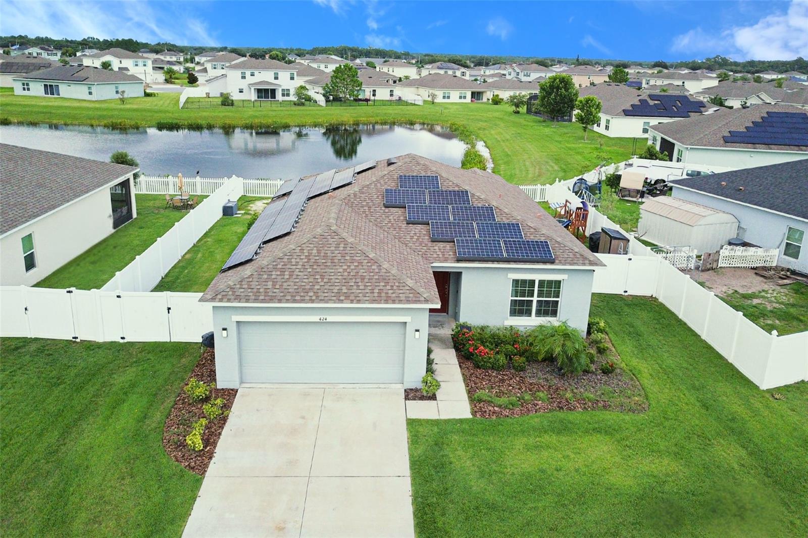 A charming 3 bedroom - 2 bathroom in the beautiful Stepping Stone community in Kissimmee! Stepping into the home provides a sense of airiness and calm, as you are greeted with big windows leading to a naturesque lakeside view. The spacious living room with the accent wall entertainment cabinet makes it perfect for hosting guests. The open kitchen allows for a great space for everyone to be involved in the fun. The details in the home, such as the light fixtures, artificial fireplace, and new flooring make for a modern, yet inviting atmosphere. Step outside to enjoy some lakeside views and a nicely fenced in backyard, perfect for hosting. Enjoy a quiet, retreated community, away from the hustle and bustle, but still close to restaurants, stores, all the fun that Orlando has to offer. Check it out today!