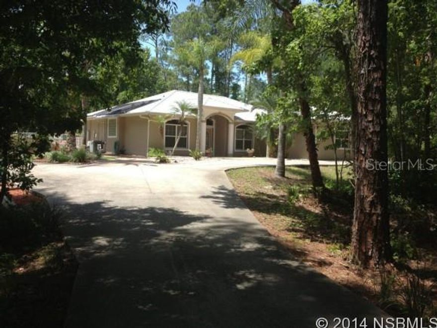 Beautiful home peacefully situated on 2.6 acres.  Private backyard with inground heated pool with hot tub.  Pool/pump house is 12 x 12. Master BR has walk-in closet with jacuzzi tub, large double head shower, glass block lighting on tub, gas fireplace.  Surround sound throughout entire house. Metal roof.  Solar panels and propane gas. City water, well for sprinkler system.  Open and bright floor plan with vaulted ceilings and plant shelves.  Trey ceilings in bedrooms. Pool area has built-in firepit.  Custom swing set.  See this one and you will truly love it.  Wooded area in back for venture seekers. Pool and spa are heated by both gas and solar.  The fireplace, tiki torches around pool and two outside gas grill connections are also supplied by propane. ;Water: City