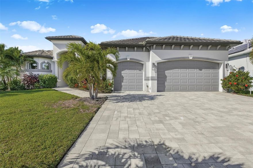 Experience the best of Florida Luxury Waterfront Living with this exceptional Cape Coral Home. This is THE home where you will experience the waterfront living you are looking for. As you enter through the front door, you will immediately be drawn to the magnificent view! The sparkling water and evening sunsets will delight you. This location offers Gulf Access, captivating straight-line water views and is only minutes to the North Spreader Canal. Enjoy the quiet neighborhood, on a peninsula, with no traffic. The home offers three bedrooms plus a den with an open concept floor plan that is ideal for entertaining. The outdoor living space will be your own private oasis, and features a heated saltwater pool, a spa and fully functional kitchen. Keep your boat ready on the covered boat lift. Bamboo flooring enhances the spacious primary bedroom which flows into the bathroom featuring a walk-through shower. A spacious, 3 car garage completes this home. Whether you’re heading out for a day on the water or enjoying sunsets from your lanai, it’s time to live the Southwest Florida Lifestyle You Deserve!