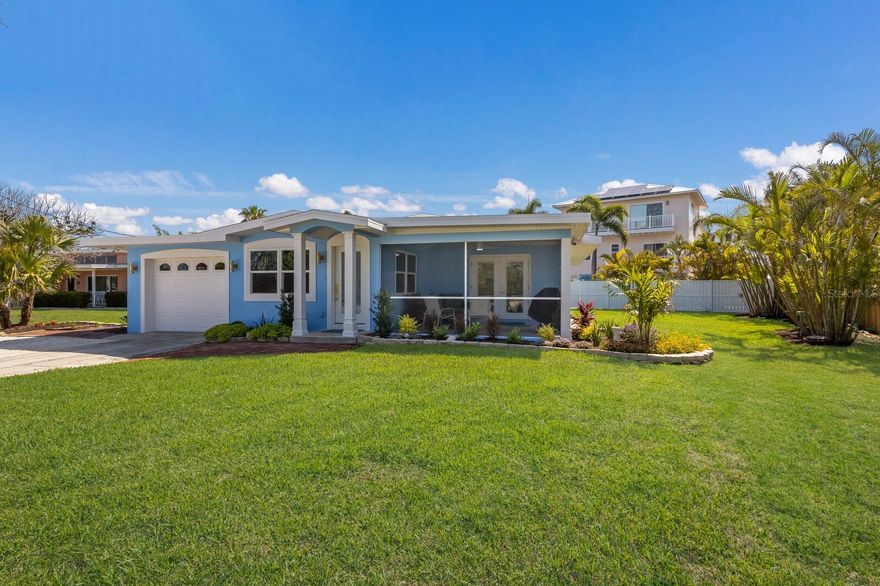 THIS ISLAND RETREAT ALSO IS A BOATERS DREAM, SEPARATE DEEDED BOAT SLIP . Do not miss out on this lovely coastal single family island home also has a separate deeded boat slip and water access right across the street from you.  No bridges to go under either, just perfect for the avid boater.  There is also plenty of room for a pool on this sizable lush tropical lot . Nicely located towards the north end with just a short stroll to the beach to watch some of Floridas breathtaking sunsets  or take a walk or bike ride and explore the two cities of Holmes Beach and Anna Maria from dining, to restaurants, and shopping. This seller has truly not left any stone unturned, in 2008/2009 this home underwent a major remodel down to the exterior walls with Gagne Construction, a long time island builder designer contractor and now this 2nd remodel, has truly put her own stylish touches on this home.  The current remodel is featuring a brand new kitchen, new stone counters, new bathrooms, new AC, new appliances , new hot water tank, new interior doors and fixtures all finished with stylish gold handles and accents throughout. This home also has a one car attached garage and a large front screened in porch to sip your morning coffee on or feel the lovely island evening breezes. Roof was done in 2017.  The home has been completely brought to life with all new fresh interior and exterior paint as well . Do not miss out on this truly adorable island retreat for you and your family. Your island retreat awaits