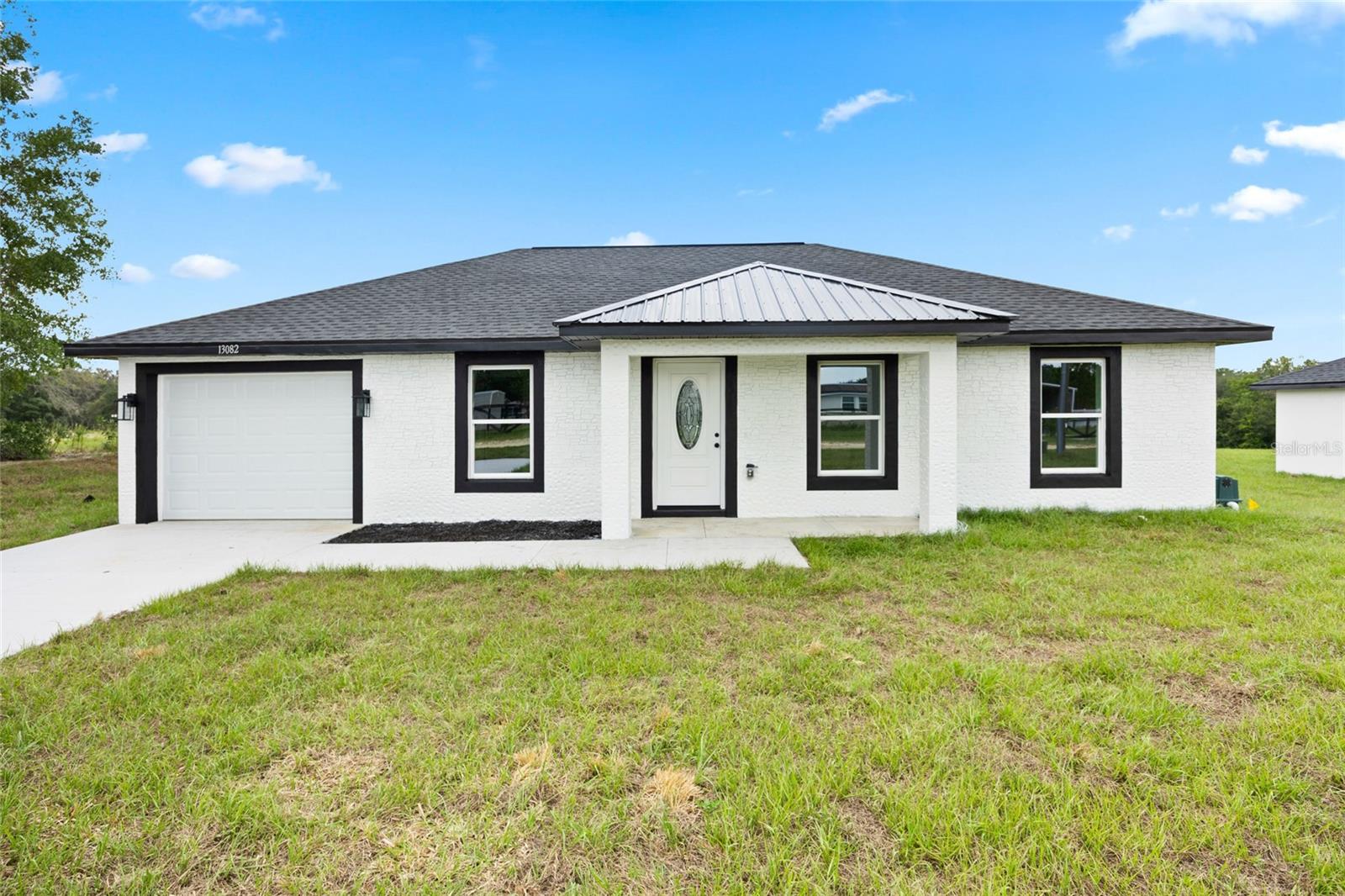 Welcome to this beautifully crafted 3-bedroom, 2-bath home, offering 1,157 sq ft of heated living space and a total of 1,521 sq ft under roof. Designed with modern comfort in mind, this home features an open-concept layout, durable laminate flooring, and a stylish kitchen equipped with stainless steel appliances including a dishwasher, microwave, and range. The spacious primary suite boasts a walk-in closet and private bath.
Enjoy the durability of block construction, a sleek shingle roof, and a slab foundation for long-lasting quality. Situated on a .23-acre lot with no HOA and no lease restrictions, you’ll have the freedom to truly make this property your own. Located in Dunnellon’s desirable Rolling Ranch Estates, you’re just a short drive to shopping, dining, and outdoor recreation, with easy access to major highways for commuting.
Don’t miss this opportunity to own a brand-new home in a growing community schedule your private showing today!