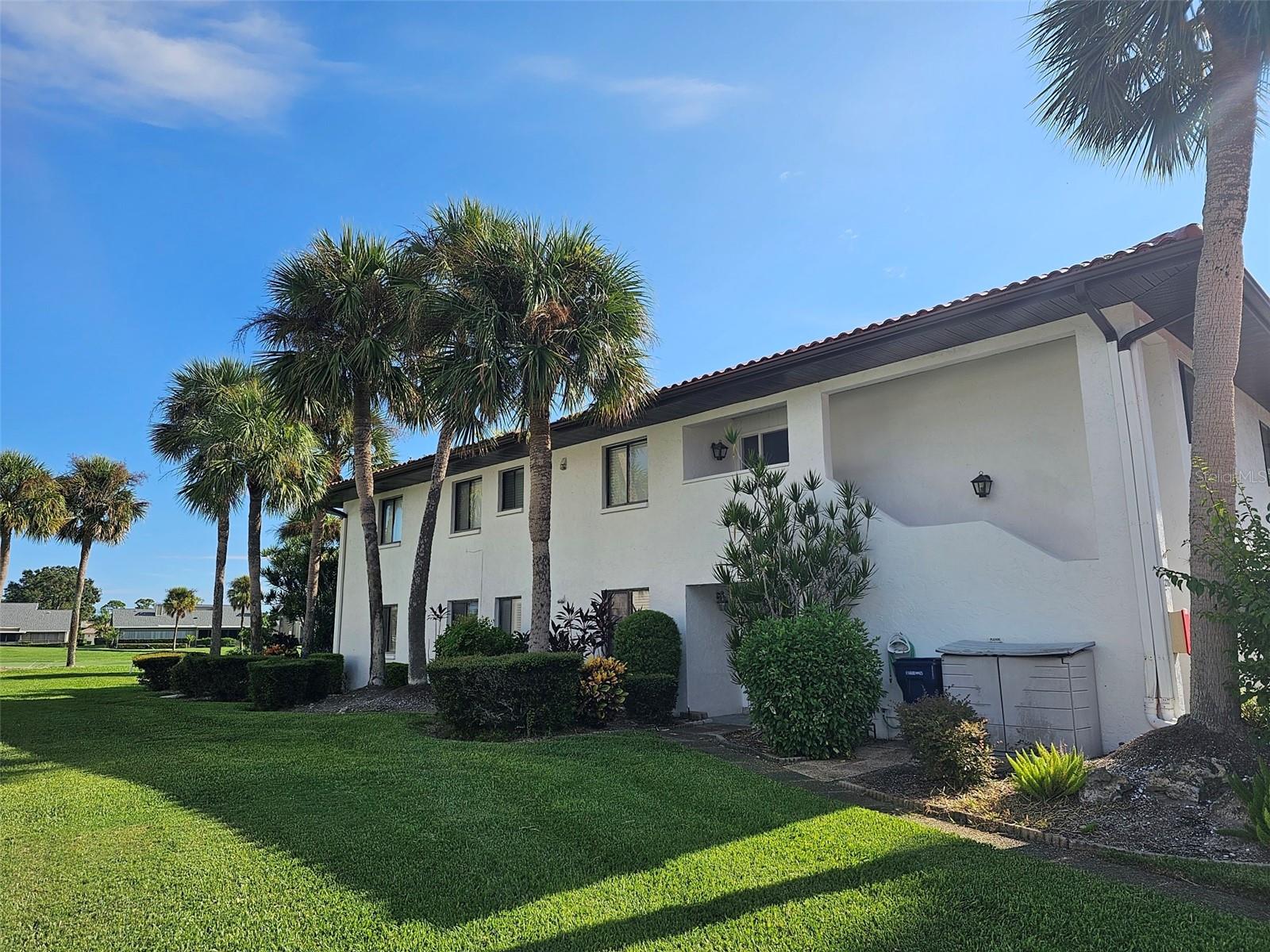HAS BEEN LEASED JAN-MARCH, 2024. Three Bedroom, Two Bath End Unit with expansive Views of IMG Golf Course in the Serene Valencia Community! Step into quiet living with this rental featuring a master bedroom that boasts a walk-in closet and a lavish king-size bed. The well-appointed bathroom comes with a refreshing shower. Accommodate guests in style with one bedroom furnished with twin beds and another featuring a comfortable sleeper sofa. Enjoy the perfect blend of indoor and outdoor living with front and rear open patios, complemented by a glass-enclosed Florida room. The spacious kitchen, complete with a washer/dryer, breakfast bar and lots of cabinets, opens up to the inviting living and dining rooms, creating an ideal space for both relaxation and entertainment. Your convenience is our priority, as this rental comes with one covered parking space. Indulge in the picturesque surroundings of the IMG Golf Course, and take advantage of the proximity to renowned beaches just a short drive away. Explore the area with restaurants, shopping options, schools, and more right at your fingertips.