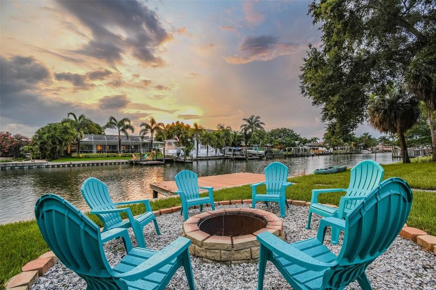 Welcome to Dana Shores! This single-story residence features 2,088 sq ft of living space, 4 beds, 2 baths, 2 car garage, and a patio with dock! Be greeted to stunning COASTAL CURB APPEAL with a NEWER ROOF and an OVERSIZED driveway. Clean lines, fresh paint, and MODERN LAMINATE FLOORs sprawl throughout the home! A HUGE OPEN family room combo runs into the DREAM KITCHEN that offers marble countertops, SLEEK CABINETRY, RECESSED LIGHTING, STAINLESS STEEL appliances, huge island, pendent lights, under cabinet lighting, range hood, built in microwave, and backsplash! The primary bedroom is a great size with two closets. Primary bath has a sleek vanity with huge SHOWER that has new seamless glass doors! All the secondary bedrooms are well sized with ample closet space. Enjoy TRUE FLORIDA LIVING lounging on your patio or toss some lines off your dock! It's all about the SALT LIFE OUT HERE! Bring your BOAT/RV as this neighborhood has NO HOA! Additional features include: UPDATED SEAWALL, UPDATED WINDOWS, NEWER HVAC'S, PERGOLA, TANKLESS WATER HEATER,NEW SOD/LANDSCAPE, DEISGNER FIXTURES, CROWN MOLDING, FIREPIT, HAMMOCK, & so much more! All while showcasing a perfect central location CLOSE TO EVERYTHING TAMPA BAY HAS TO OFFER. Lawn care is also included! Make your appointment today!